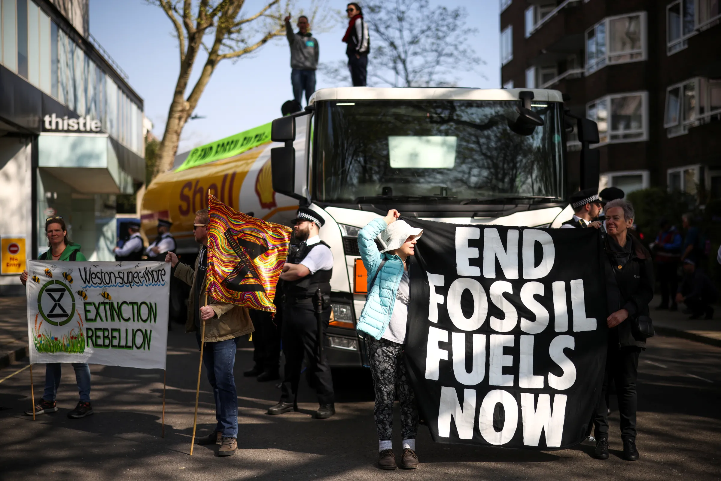 Activists from Extinction Rebellion occupy an oil tanker during a protest calling for an end to fossil fuels, in central London, Britain, April 16, 2022. REUTERS/Henry Nicholls