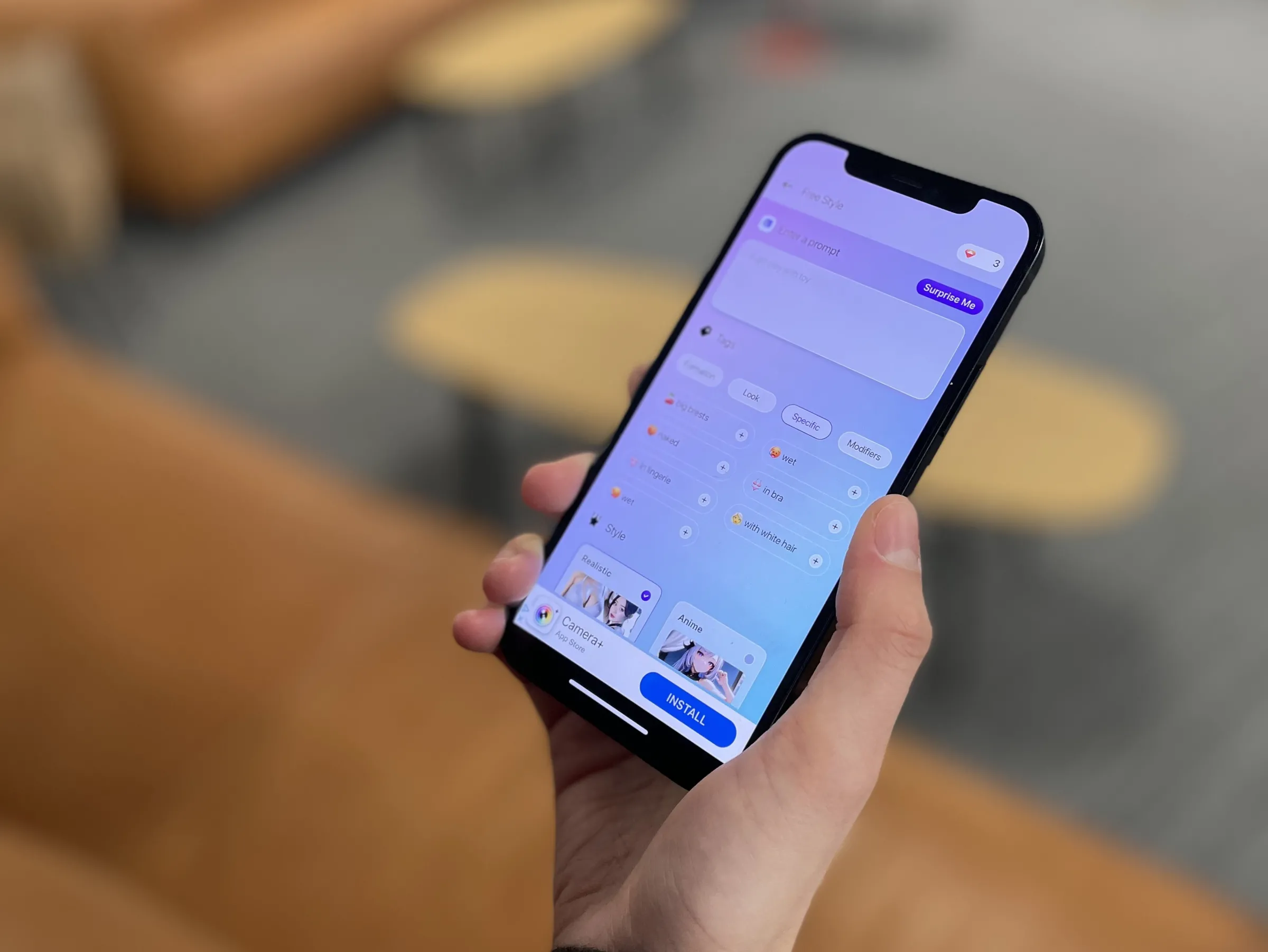 A person holds a phone showing a screenshot of the AI art app MatureAI. July 16. Thomson Reuters Foundation/Adam Smith
