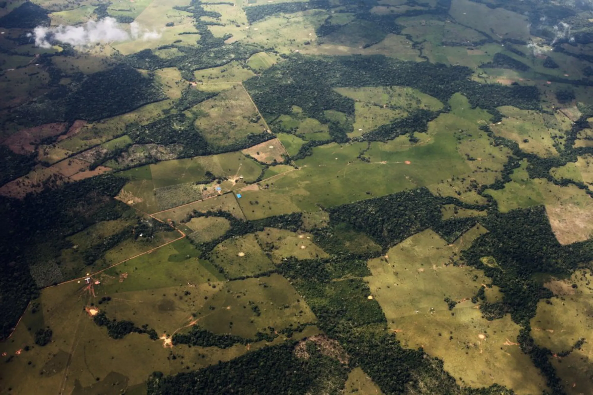 An aerial view of farms interspersed with Amazon rainforest that gradually gives way to pristine forest towards Colombia’s southeast Amazonas province, December 21, 2021