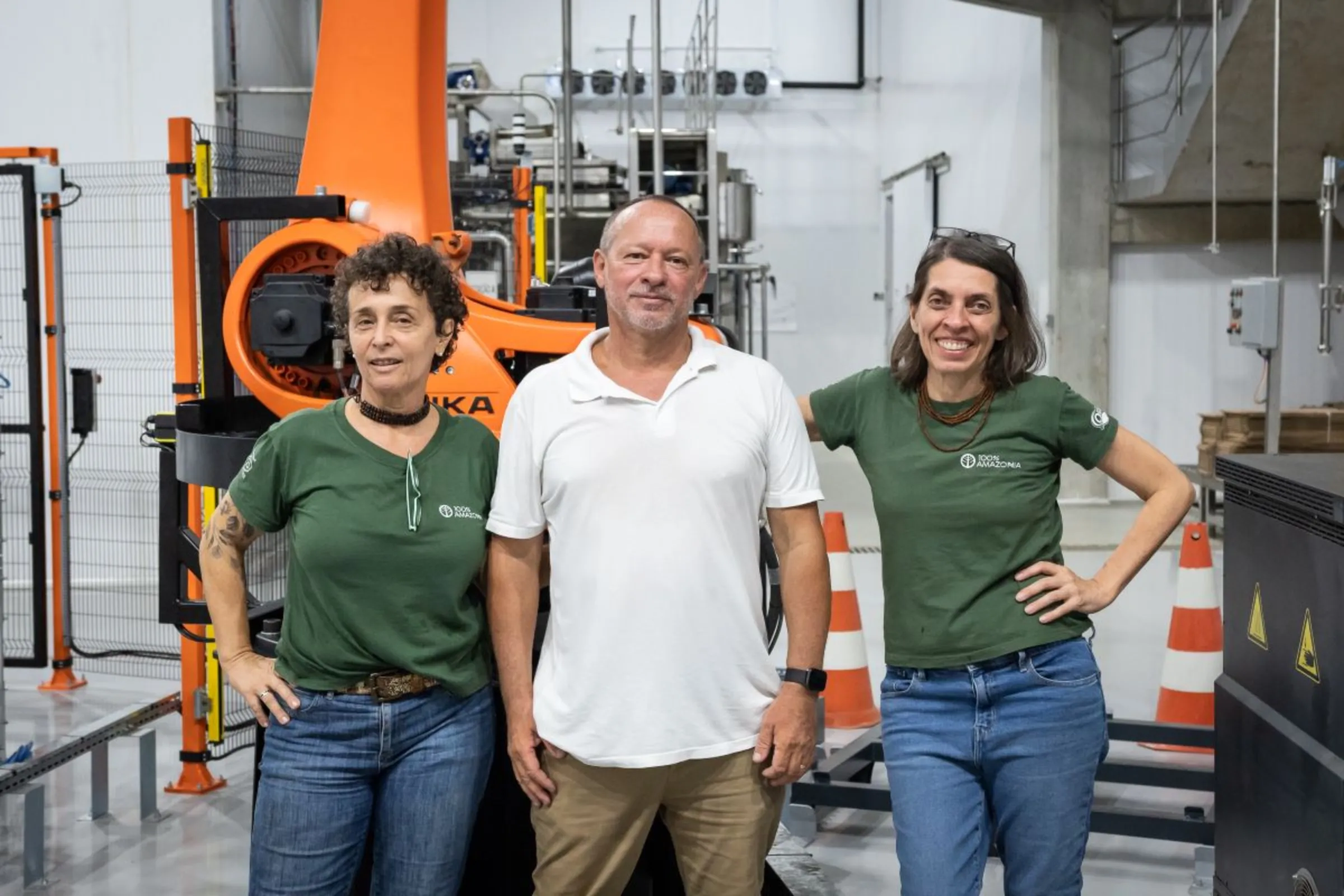 Jo Alves, Giovani Alves and Fernanda Stefani pose at the factory their company, 100% Amazonia, is setting up in Pará, Brazil, January 19, 2023. Thomson Reuters Foundation/Cícero Pedrosa Neto