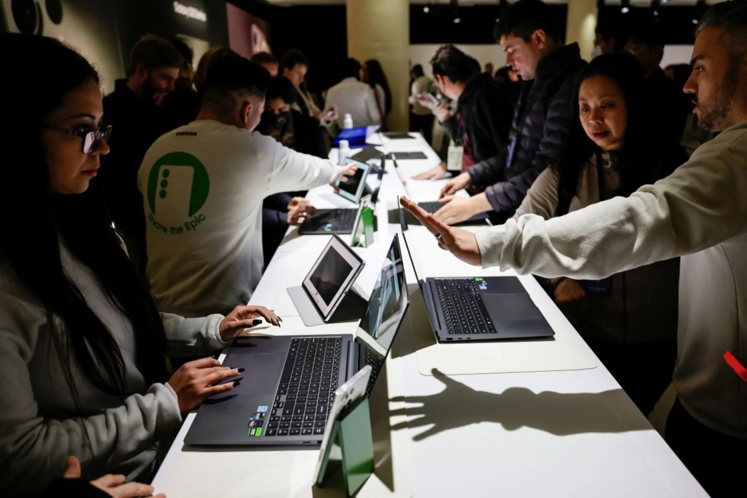 Attendees get their first look at the new Galaxy Book3 series laptops as Samsung Electronics unveils its latest flagship smartphones in San Francisco, California, U.S. February 1, 2023. REUTERS/Peter DaSilva