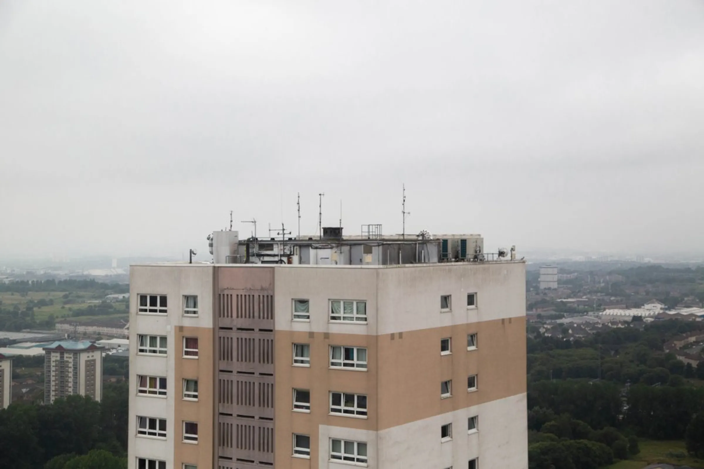 Air-source heat pumps sit on the roof of a high-rise block of flats in Glasgow, United Kingdom, July 22, 2021. The heat generated is shared among the flats in the block