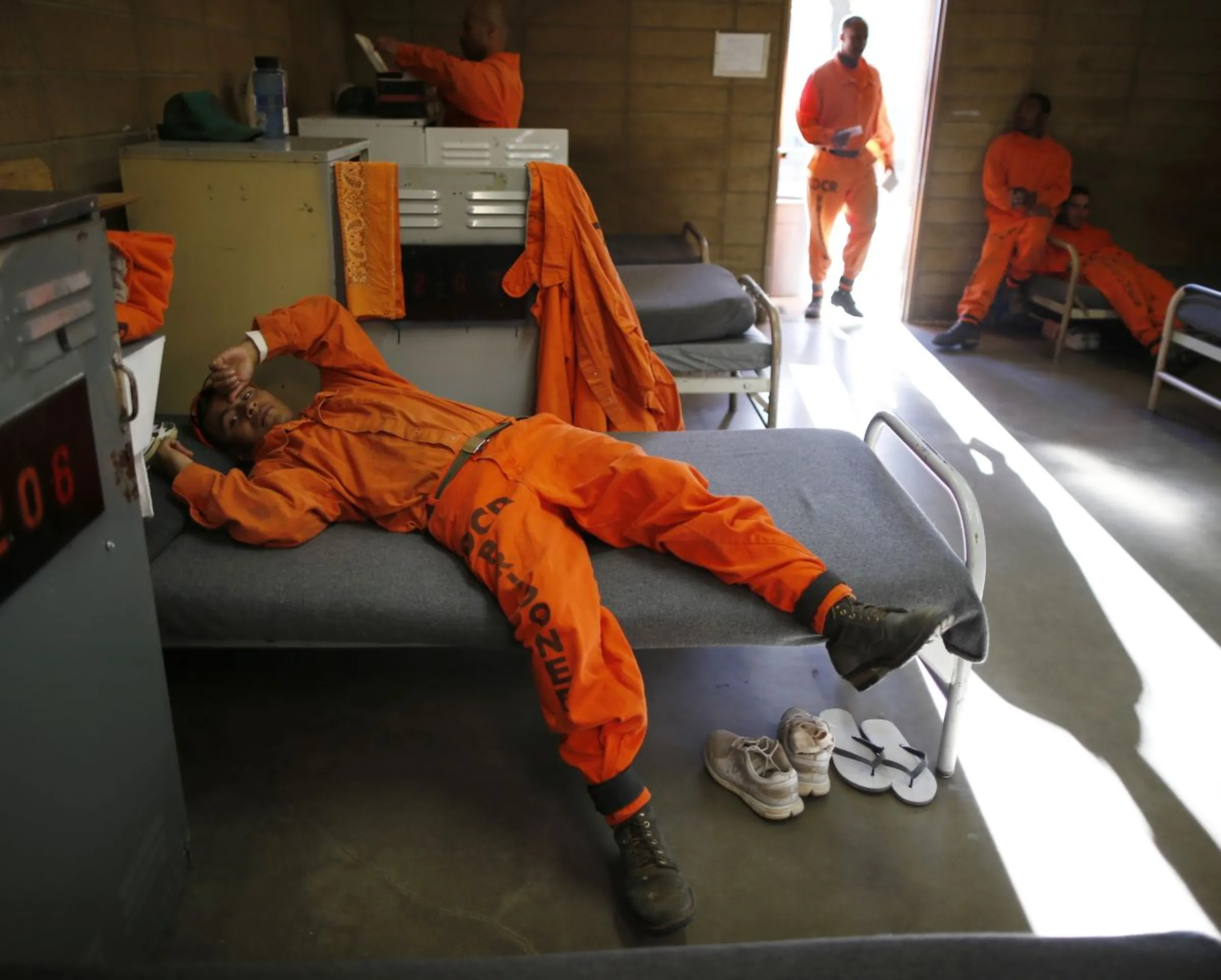 Prison inmate lies on his bed at Oak Glen Conservation Fire Camp #35 in Yucaipa, California November 6, 2014. REUTERS/Lucy Nicholson