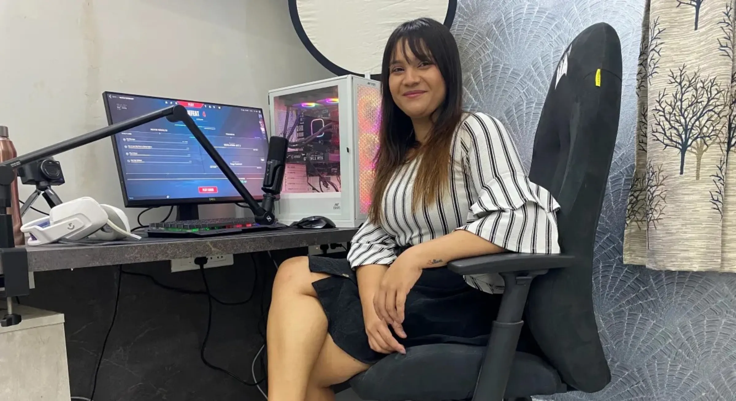 Female gamer Saloni Singh Thakur or PlayLikeIncognito poses by her computer in Hyderabad, India, April 26, 2023. Thomson Reuters Foundation/Vidhi Doshi