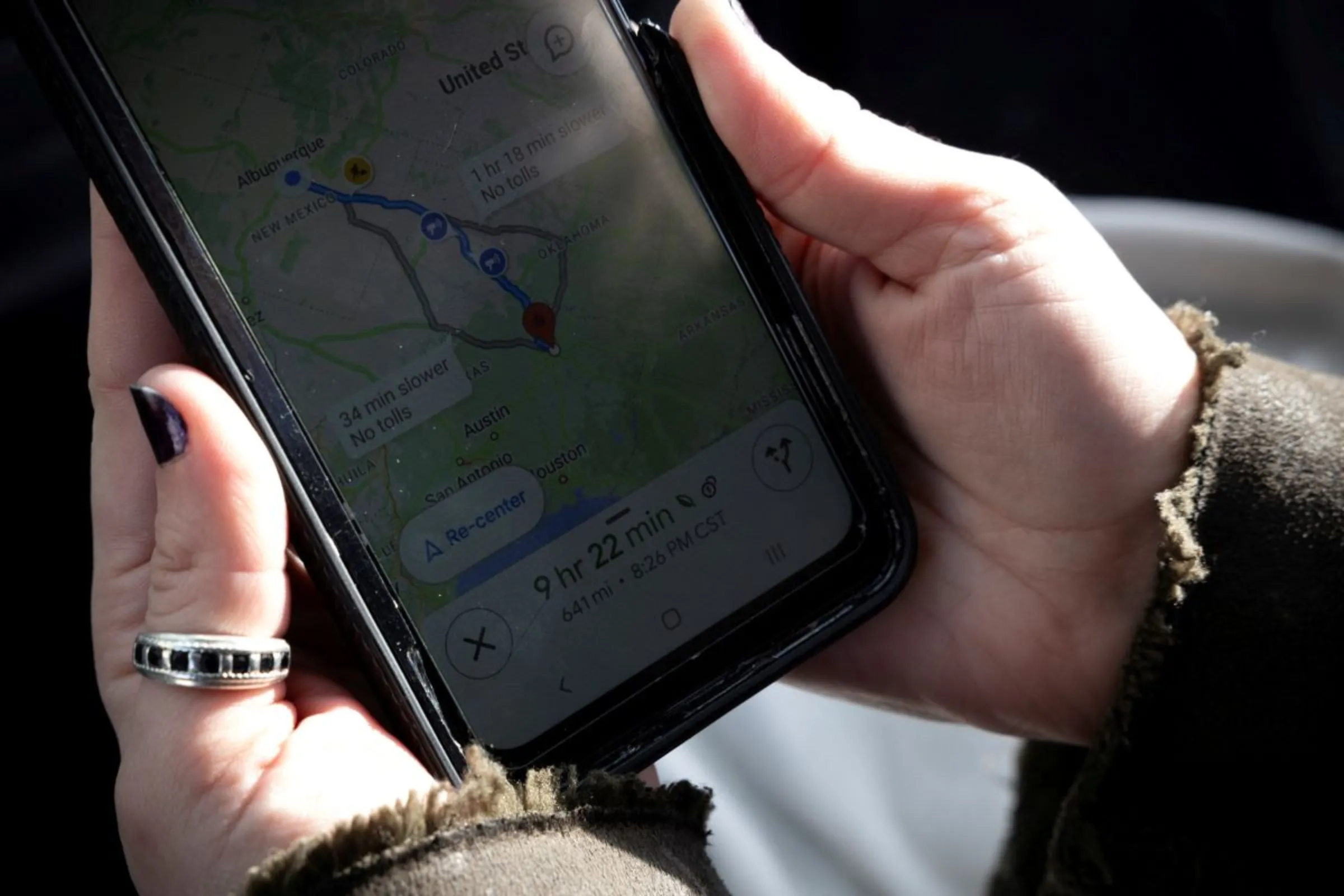 A woman, who drove from Texas to New Mexico for a medical abortion at Alamo Women's Clinic, checks her GPS before making the over 600-mile drive back to Texas, in Albuquerque, New Mexico, U.S., January 11, 2023.  REUTERS/Evelyn Hockstein