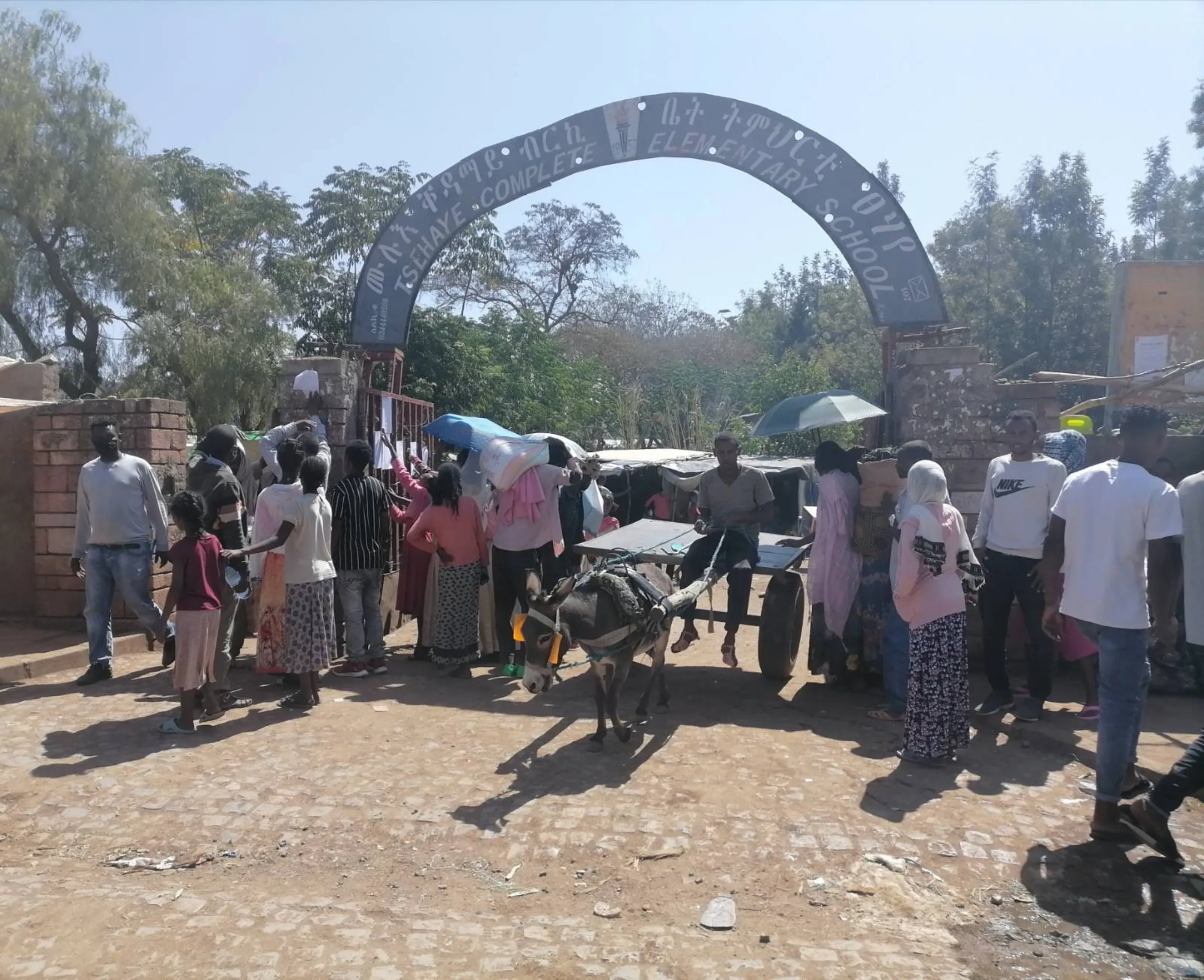 Refugees gather at the entrance to a makeshift camp in Tigray, Ethiopia. Thomson Reuters Foundation/Stringer