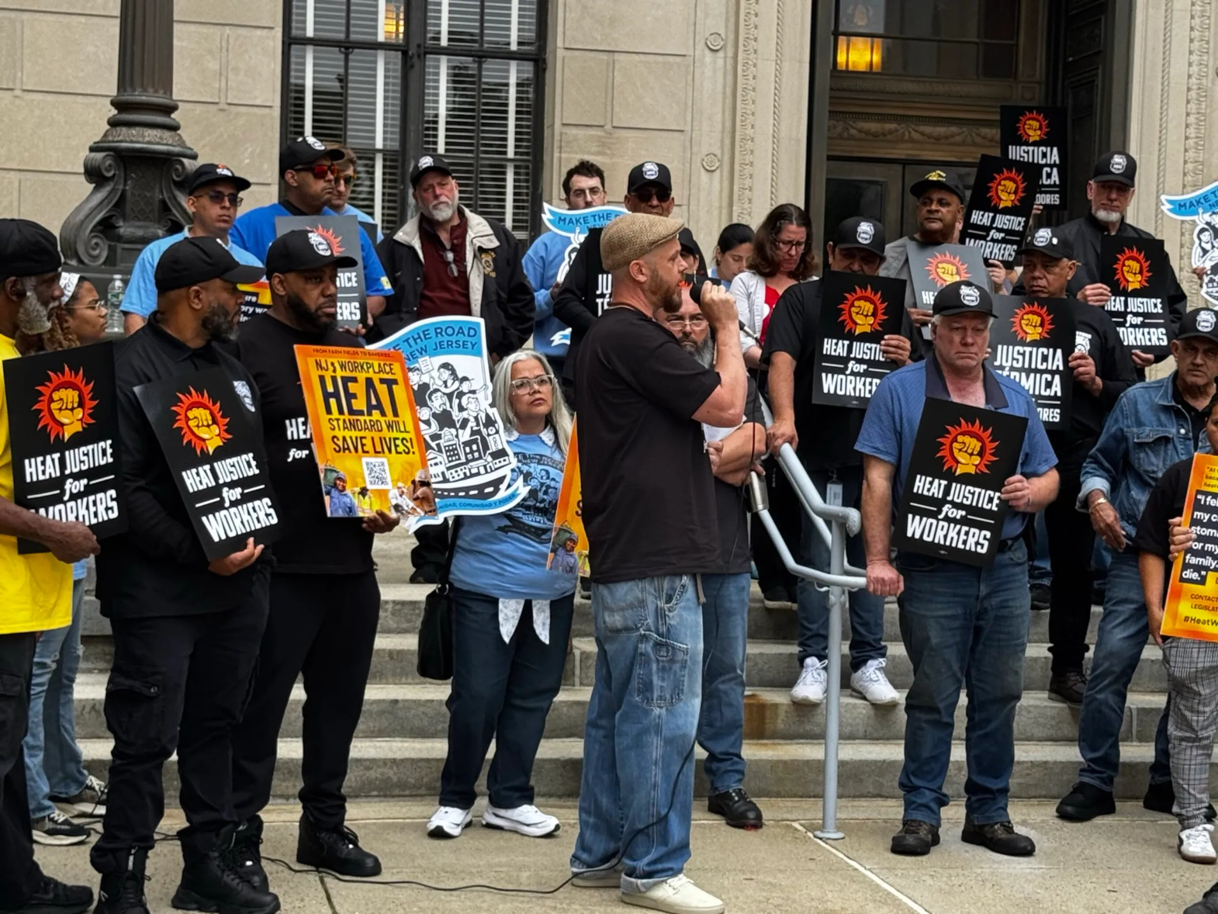 Workers and advocates take part in a Washington event on June 19 in favor of a national workplace heat standard. Fired Up For Heat Justice | National COSH/Handout via Thomson Reuters Foundation