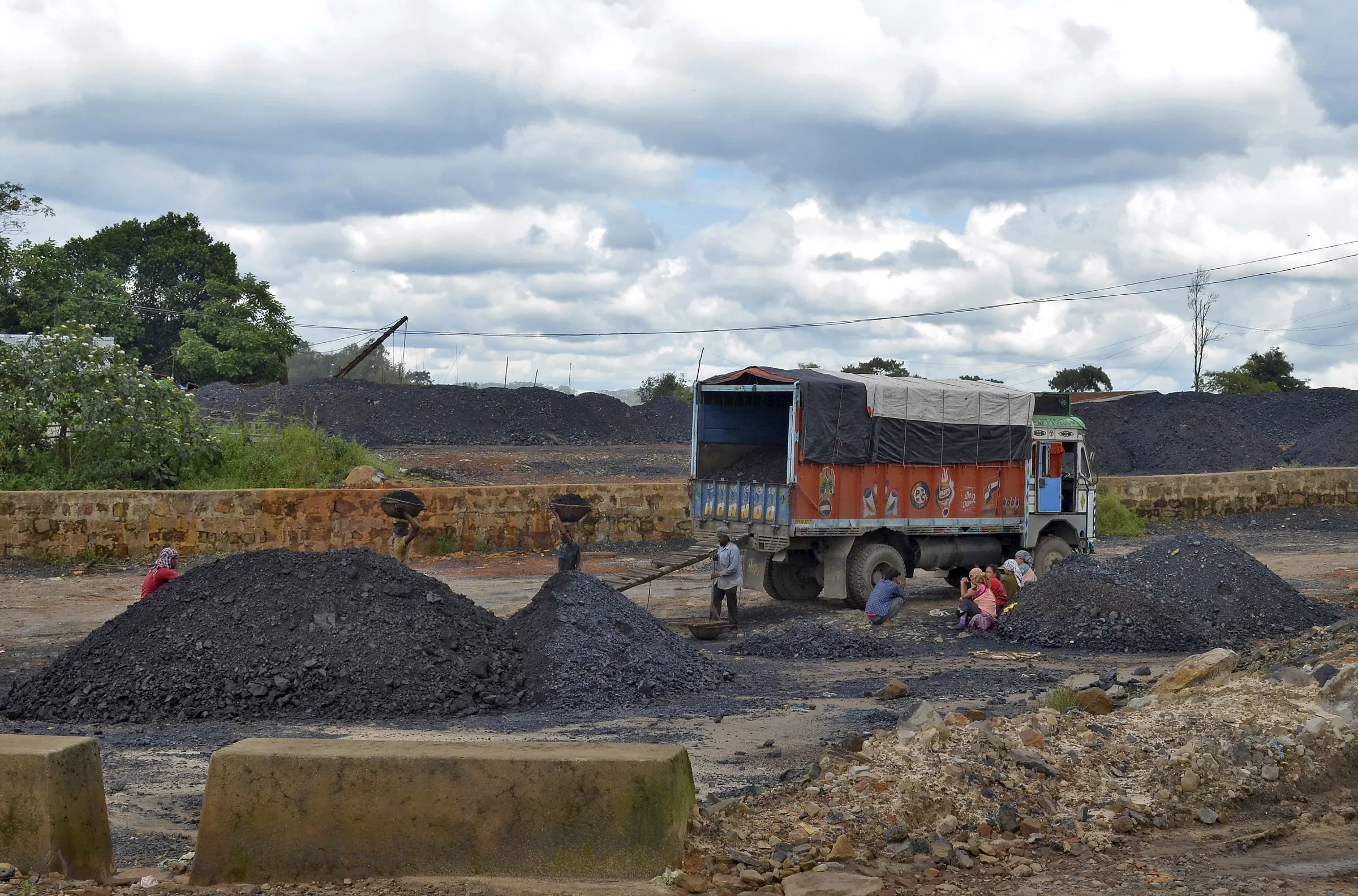 Labourers work at a coal stockyard in East Jaintia Hills in Meghalaya, India, September 16, 2015. REUTERS/Krishna N. Das