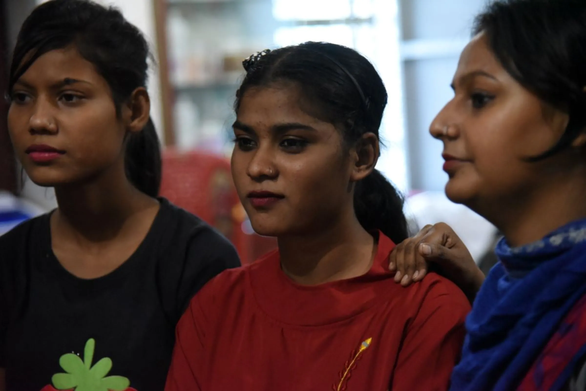 Anu Kumari (centre) poses for a picture at a skill development institute in Dhanbad, India, November 10, 2022. Thomson Reuters Foundation/Tanmoy Bhaduri