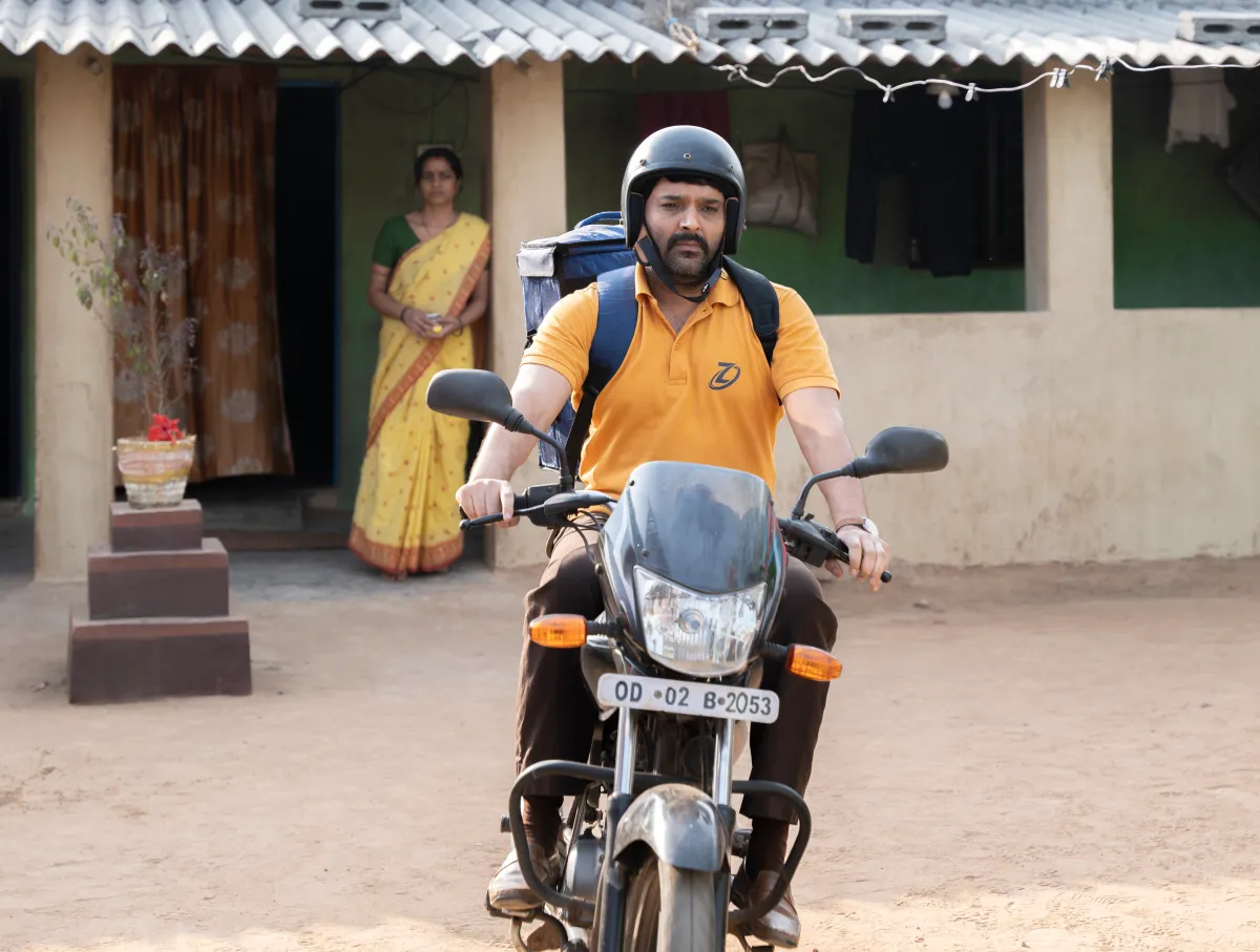 A still image of a man on his scooter from the Bollywood film "Zwigato" starring Kapil Sharma, that tells the story of a food-delivery app driver's struggle in the eastern city of Bhubaneswar, India. Applause Entertainment/Handout via Thomson Reuters Foundation