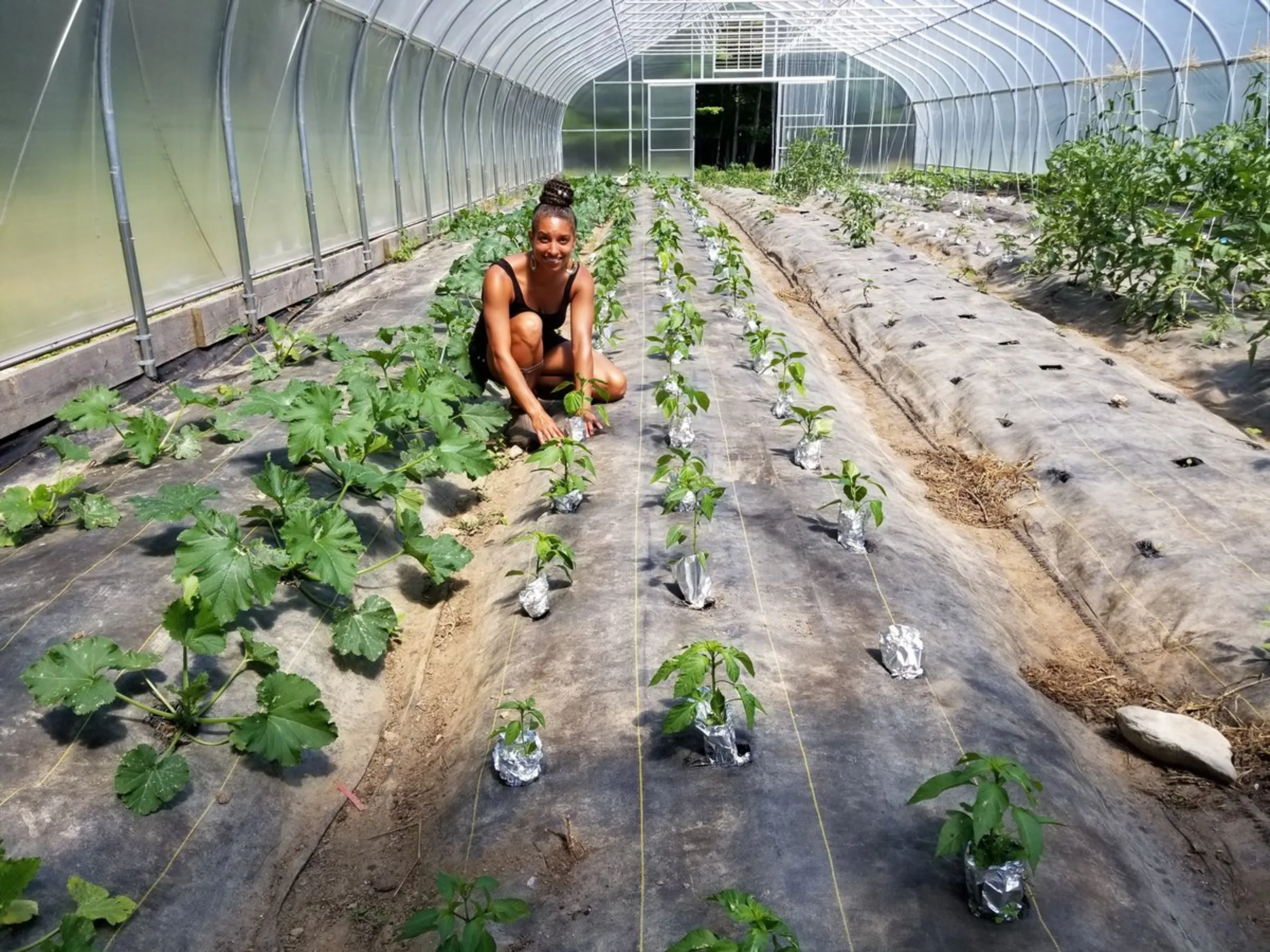 Leah Penniman, co-owner of Soul Fire Farm and 2019 James Beard Foundation Leadership Award winner, planting pepper seedlings at the farm in New York