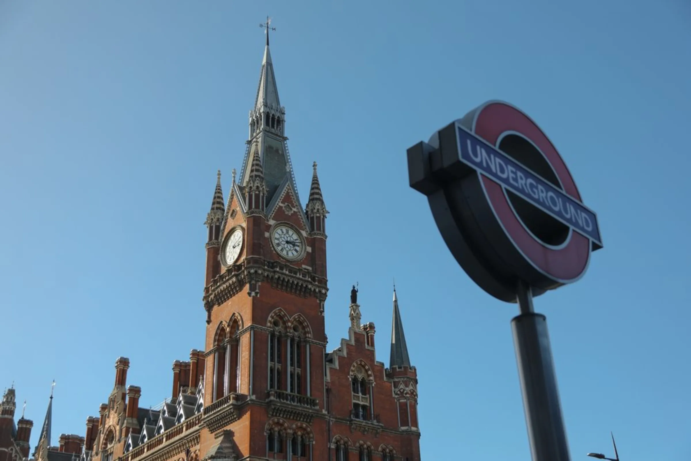 A spire towers above a sign for the King’s Cross Underground Station, one of nearly 60 “tube” stations researchers say are at growing risk of flooding in London, England, on October 21, 2021