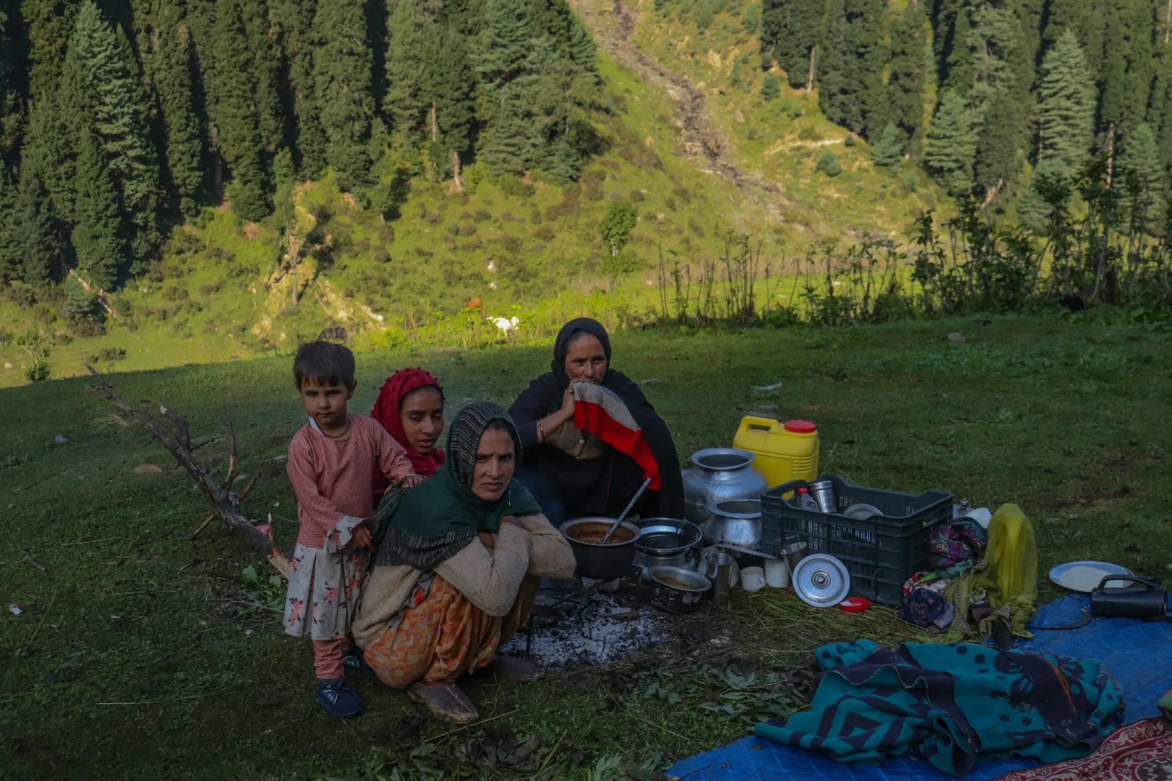 Ruksana (front), a member of the Gujjar nomadic community, lost a baby when heavy rain and strong winds made it difficult to get to the nearest hospital when she went into early labour, in Aru Valley, Jammu and Kashmir, India, Sept. 14, 2022