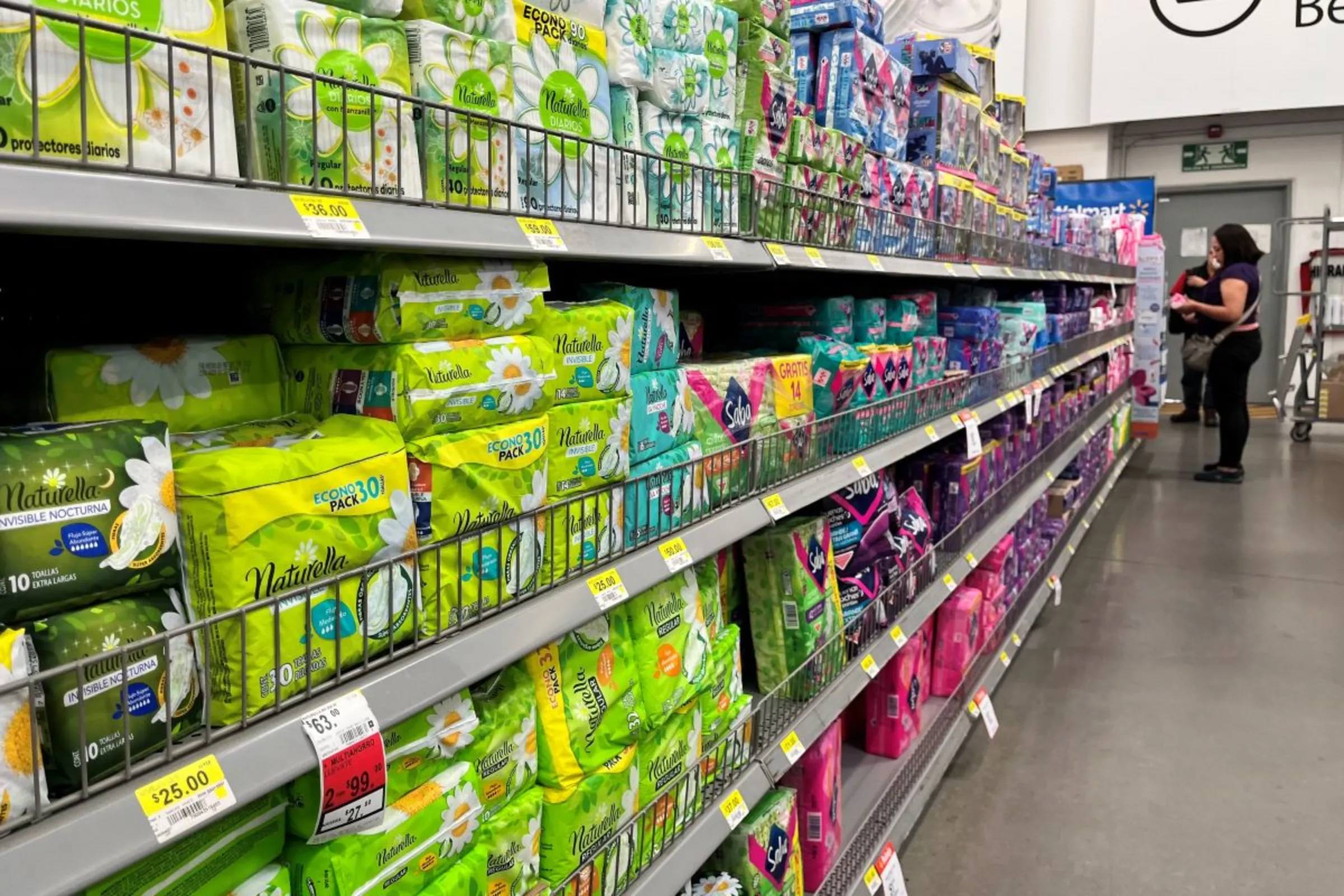 A woman selects a package of sanitary pads inside a supermarket in Mexico City, January 24, 2023