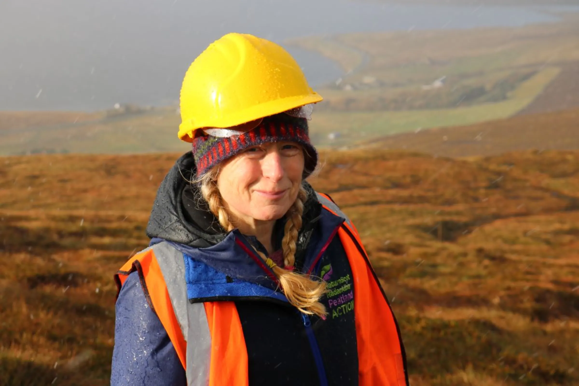 Sue White, Peatland ACTION project officer at the Shetland Amenity Trust, got into peatland restoration after her house was flooded by a peat slide 11 years ago, pictured here on a restoration site on Mainland island near Tresta hamlet, Shetland, Scotland, November 1, 2023. Thomson Reuters Foundation/Jack Graham