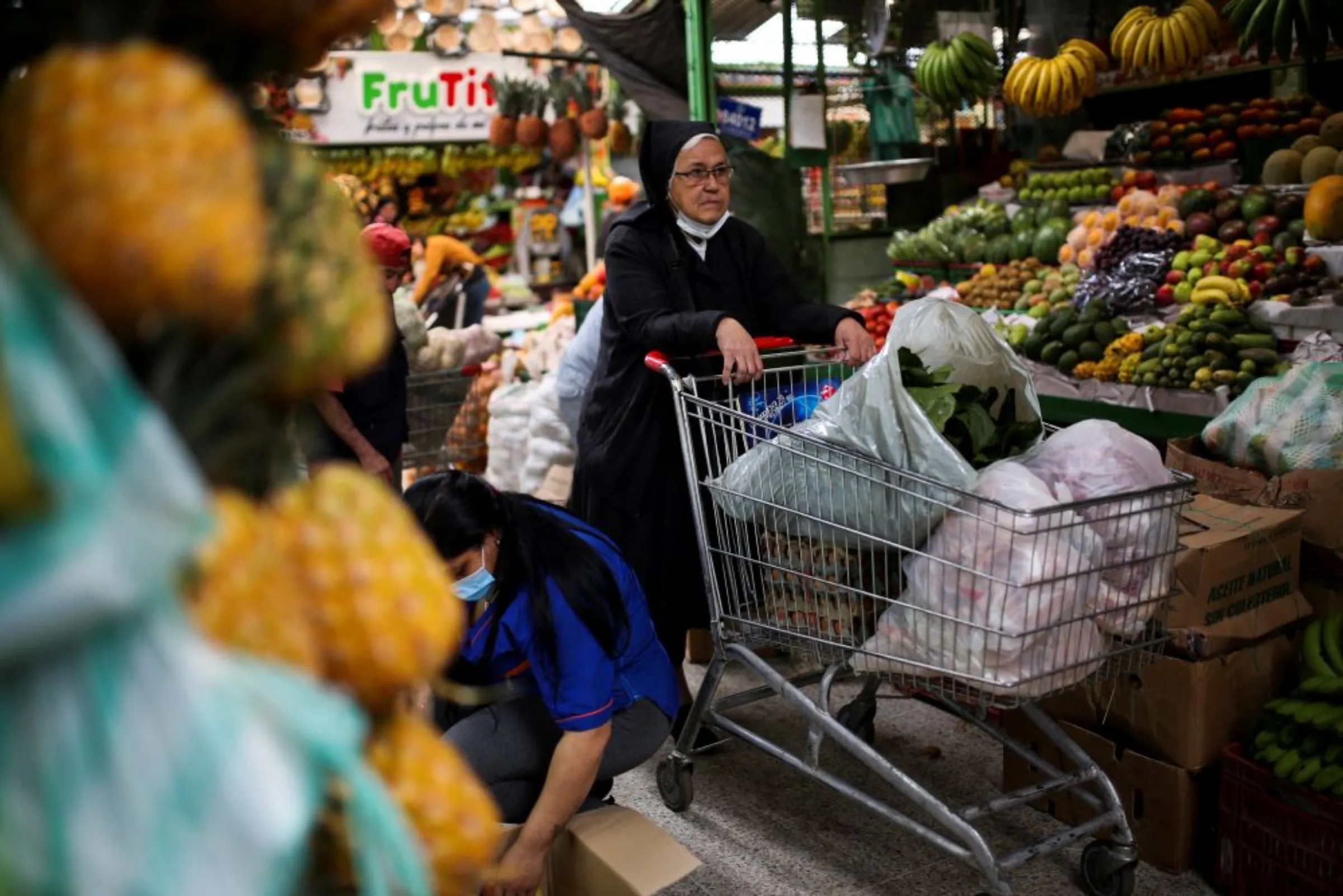 A nun shops in the Paloquemao market square, amid inflation reaching the highest figures in years, in Bogota, Colombia October 7, 2022. REUTERS/Luisa Gonzalez