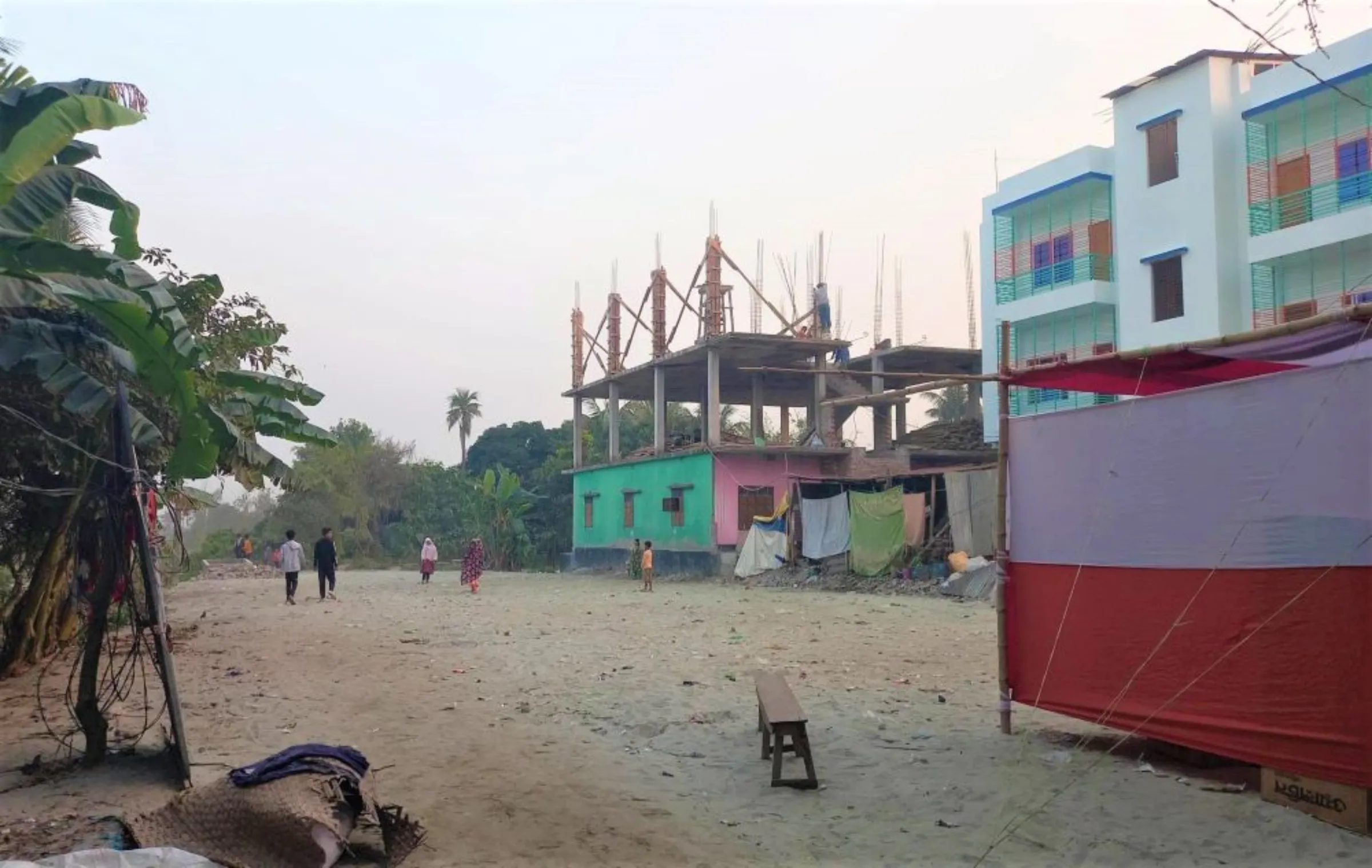 New buildings sprout up in the neighborhood near the economic zone in the context of bullish trends in the land market, Narayanganj, Bangladesh, January 11, 2022, Thomson Reuters Foundation/ Md. Tahmid Zami