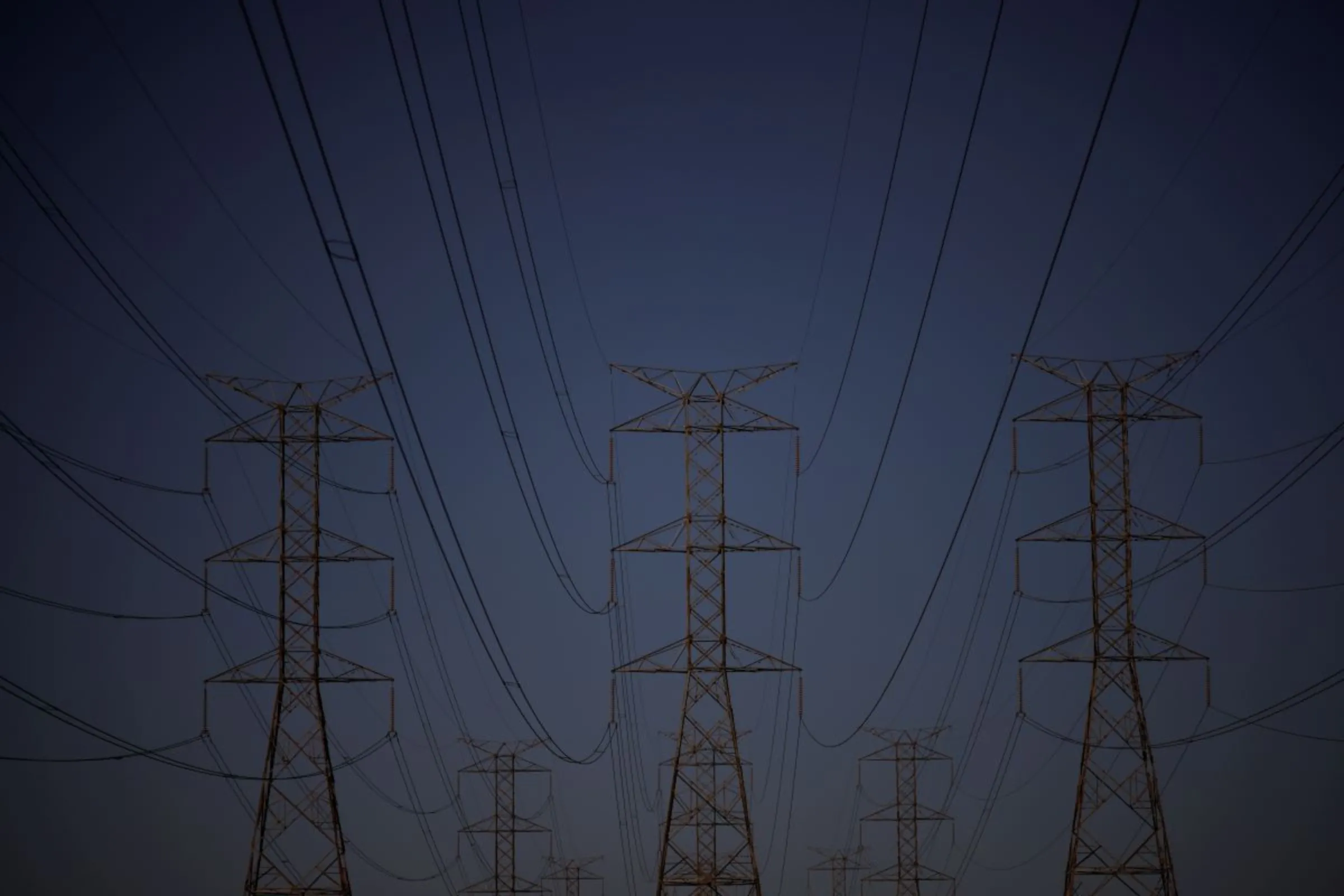 Pylons of high-tension electricity power lines are seen during sunset in Brasilia, Brazil June 6, 2022. REUTERS/Ueslei Marcelino