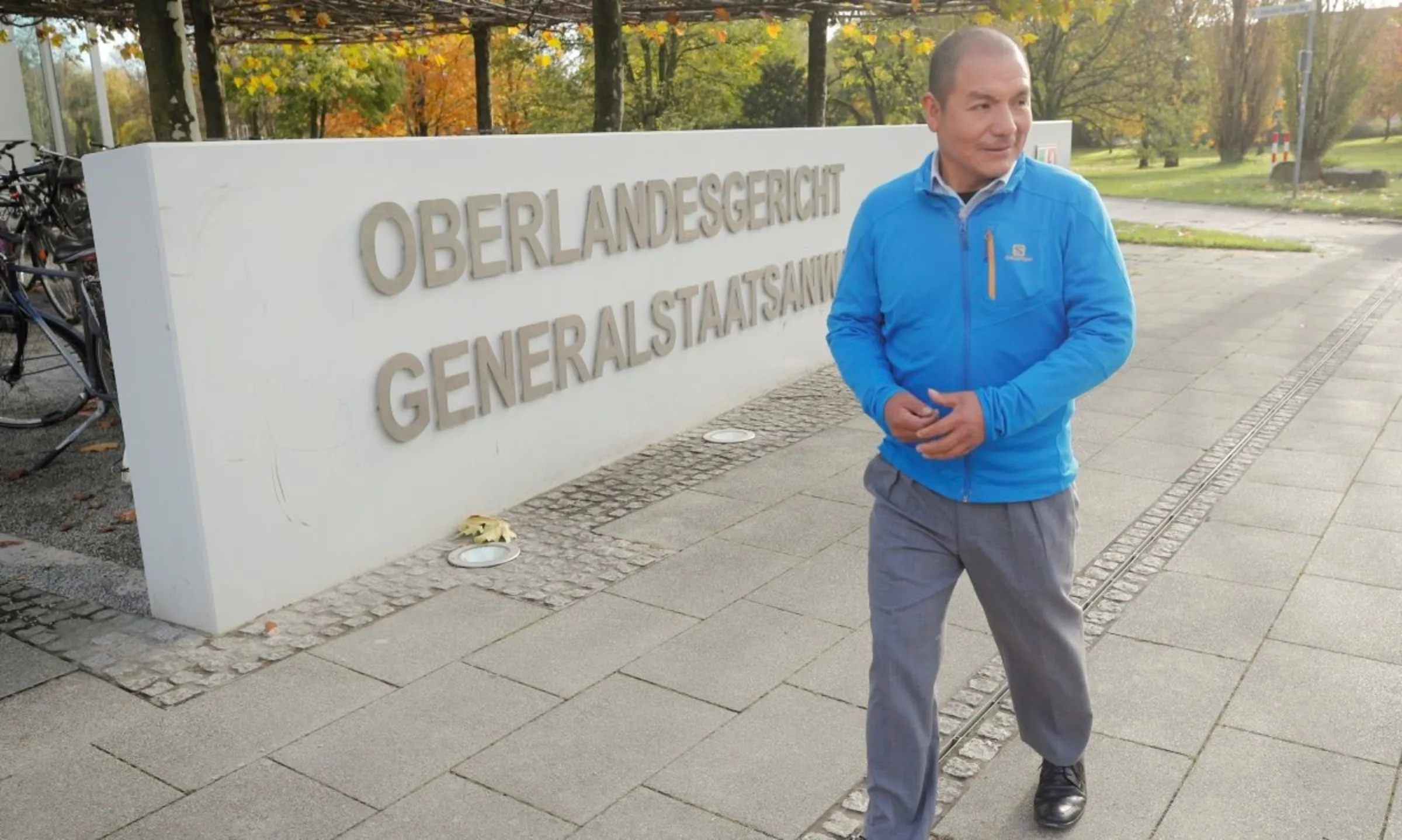 Peruvian farmer and mountain guide Saul Luciano Lliuya walks in front of the high regional court of Hamm before taking RWE, one of Europe's biggest electricity companies to court for causing the climate change, in Hamm, Germany, November 13, 2017