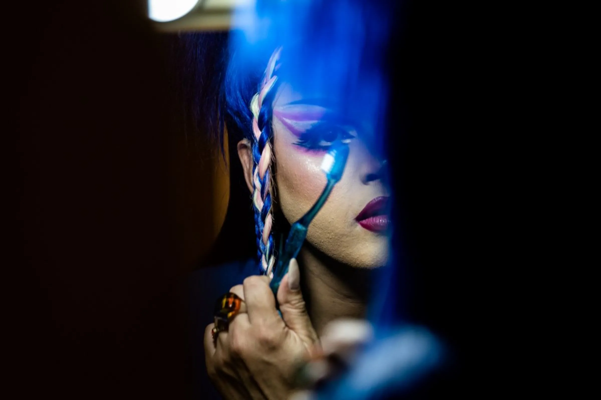 Paraguayan drag queen Dislexia Severa gets ready in her bathroom mirror in the historic centre of Asunción, Paraguay, February 22, 2023