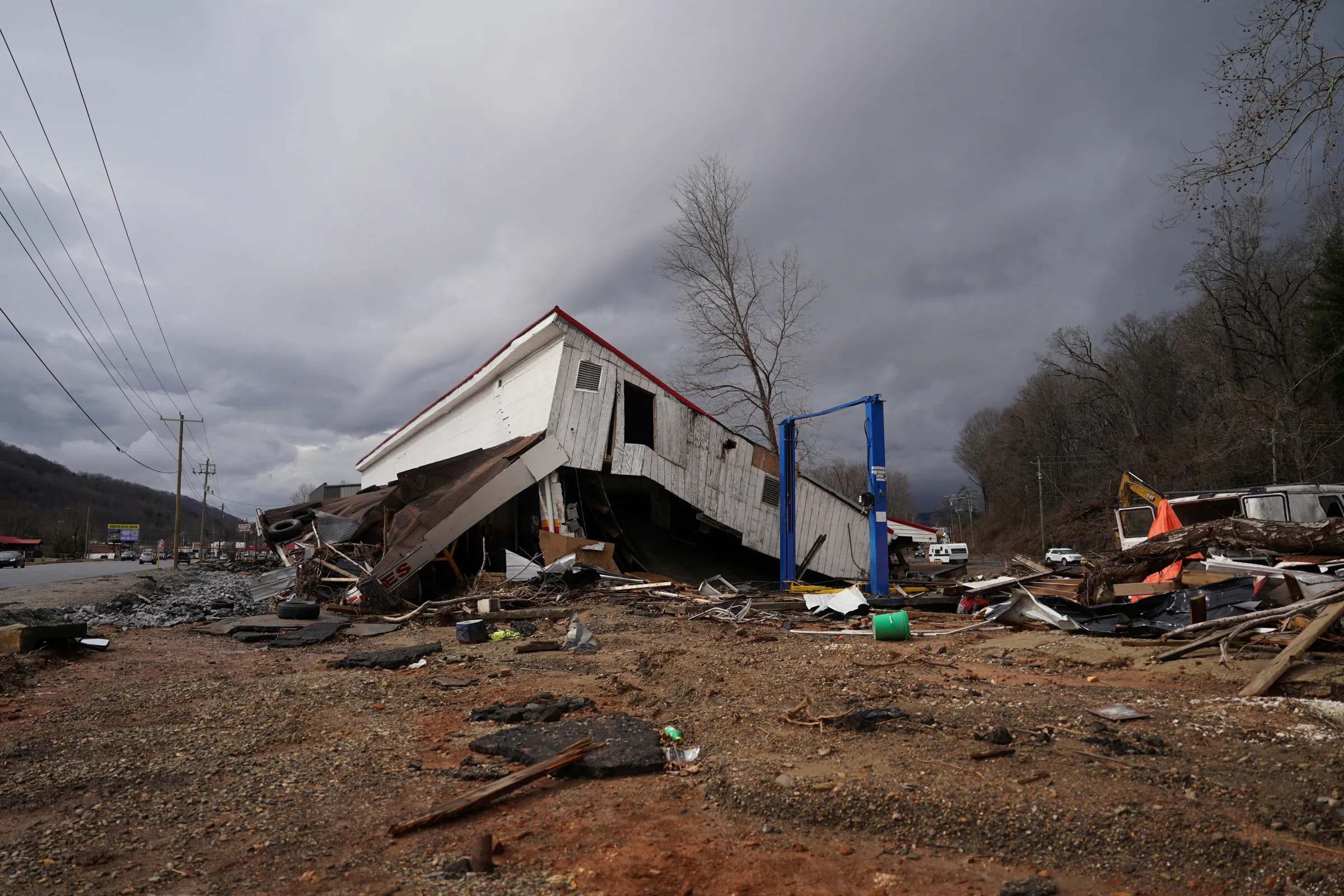 Rubble lies around a damaged building in the aftermath of Hurricane Helene in Swannanoa, North Carolina, U.S., February 15, 2025. REUTERS/Allison Joyce