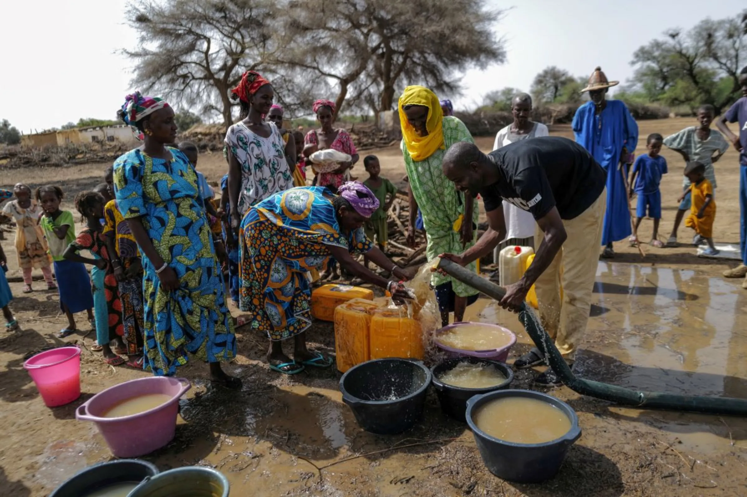 A social activist who gained recognition for renovating schools and is now crowdfunding to build wells in villages around Senegal with no access to water, pumps water from a well that is being constructed in Ourou Amady Bagga, Podor region, Senegal July 8, 2023.REUTERS/Zohra Bensemra