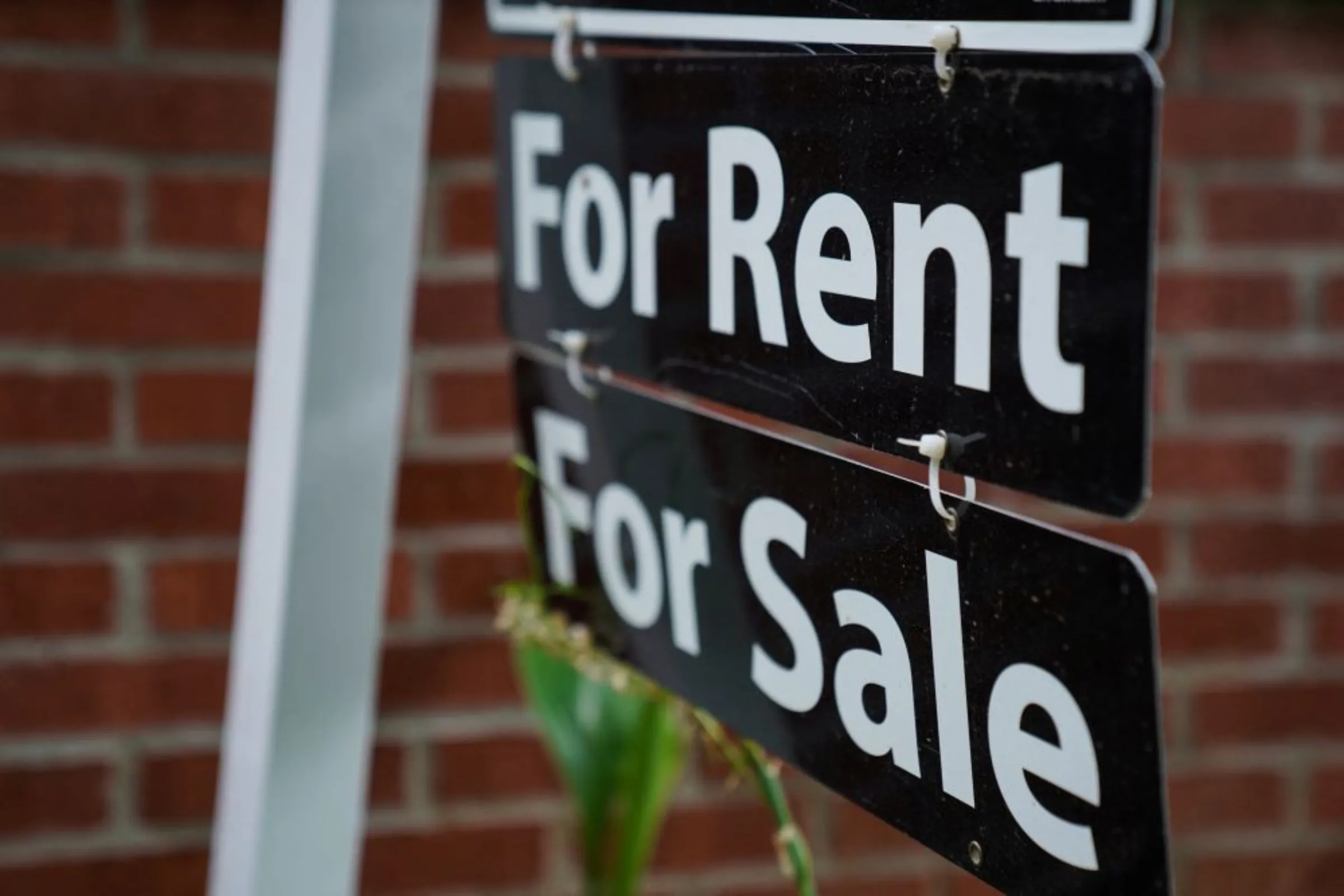 A 'For Rent, For Sale' sign is seen outside of a home in Washington, U.S., July 7, 2022