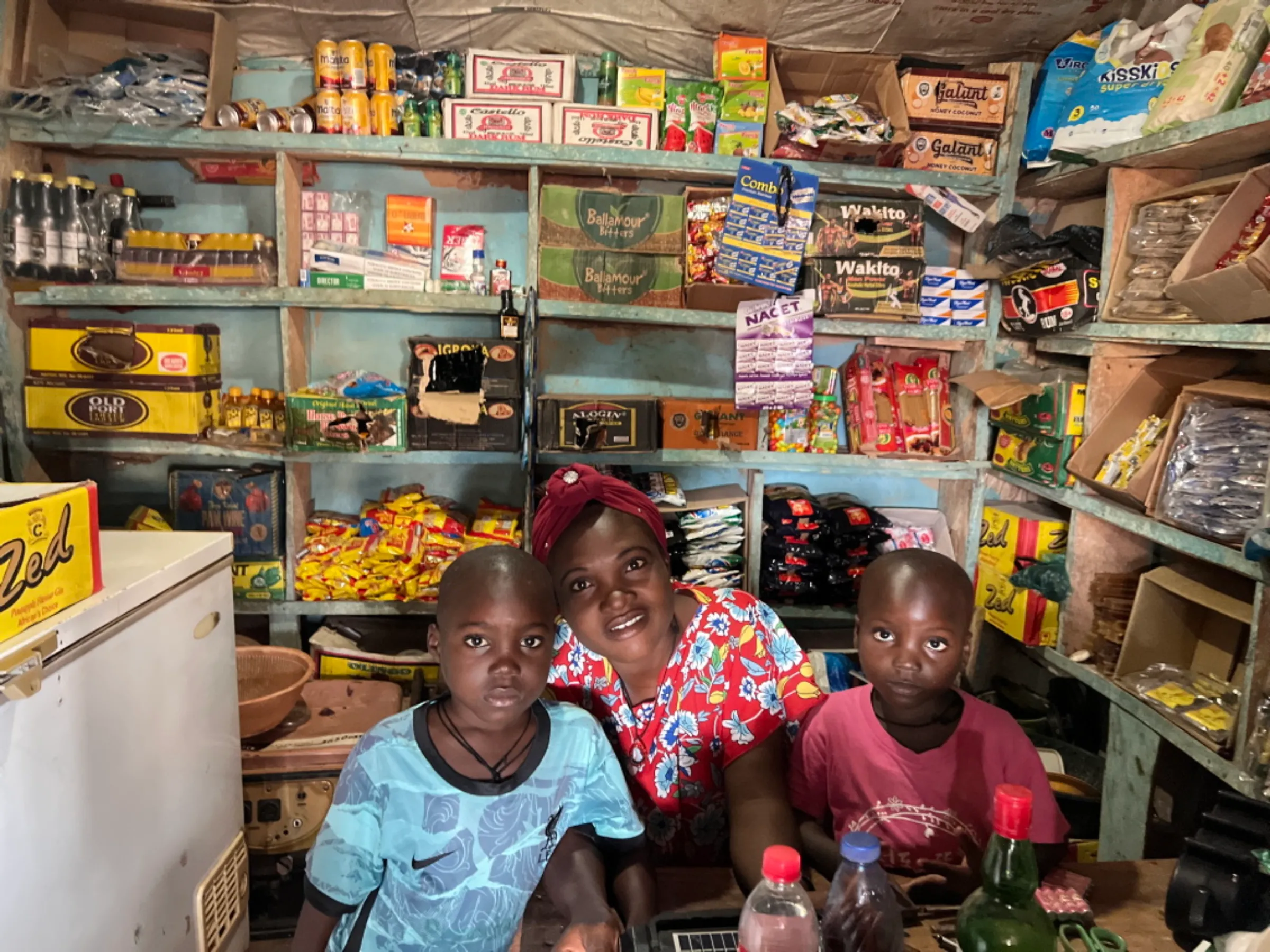 A solar-powered light bulb illuminates Victoria Olije's grocery shop in Igbabo, Nigeria, September 27, 2022. Thomson Reuters Foundation/Afolabi Sotunde