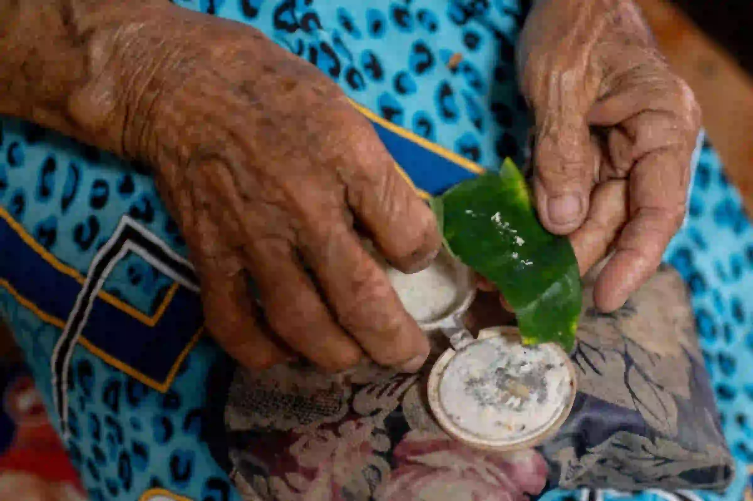 Maria Quilantang, a member of the Malaya Lolas, prepares her medicine, in Pampanga province, Philippines, August 24, 2023. Thomson Reuters Foundation/Lisa Marie David