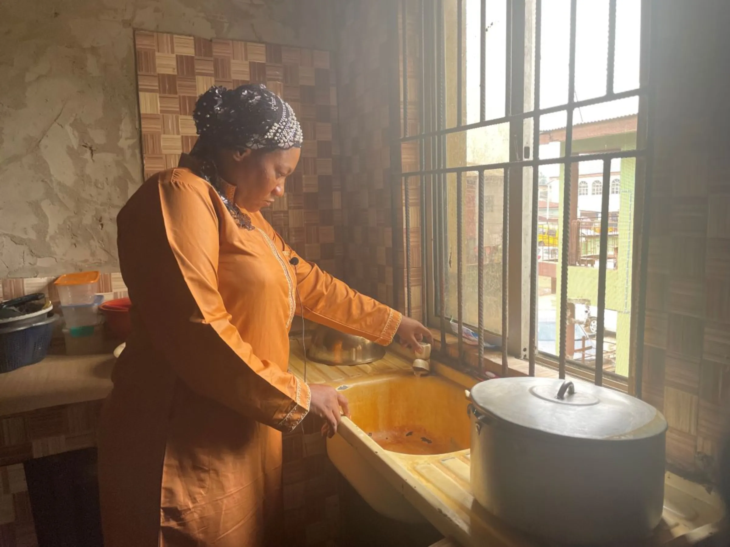 Rasheedat Arashi stares at the kitchen sink damaged by the contaminated water, Lagos, Nigeria. May 18, 2023