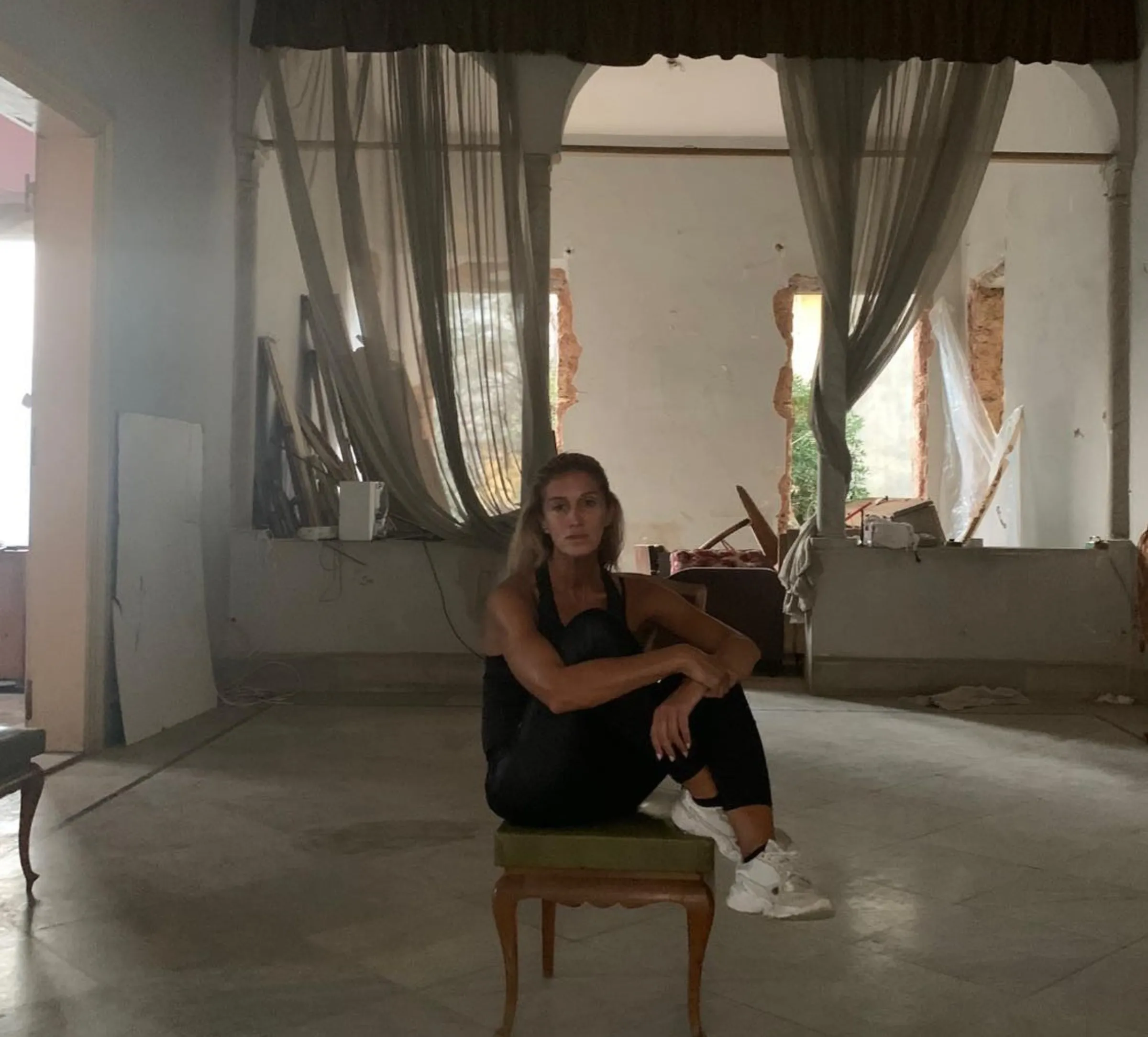 Christiane Jammal sits in her destroyed home