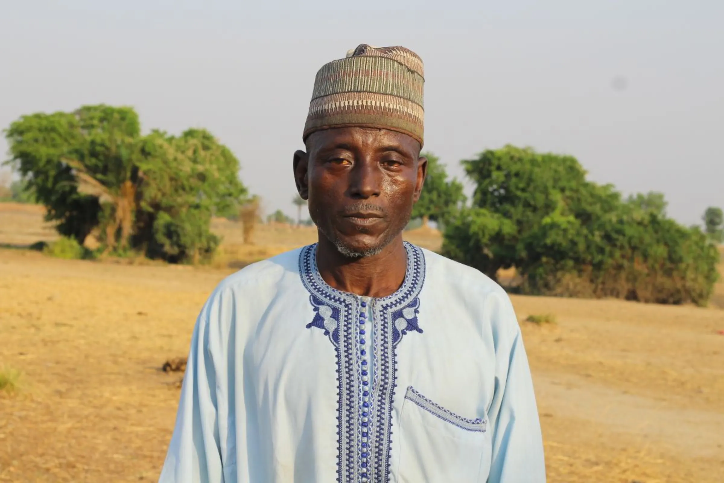 Rice farmer Muhammed Chado said he lost a whole harvest to floods and he’s struggling to repay loans and feed his family in Sosa, Niger, Nigeria, on March 14, 2023. Bukola Adebayo/Thomson Reuters Foundation