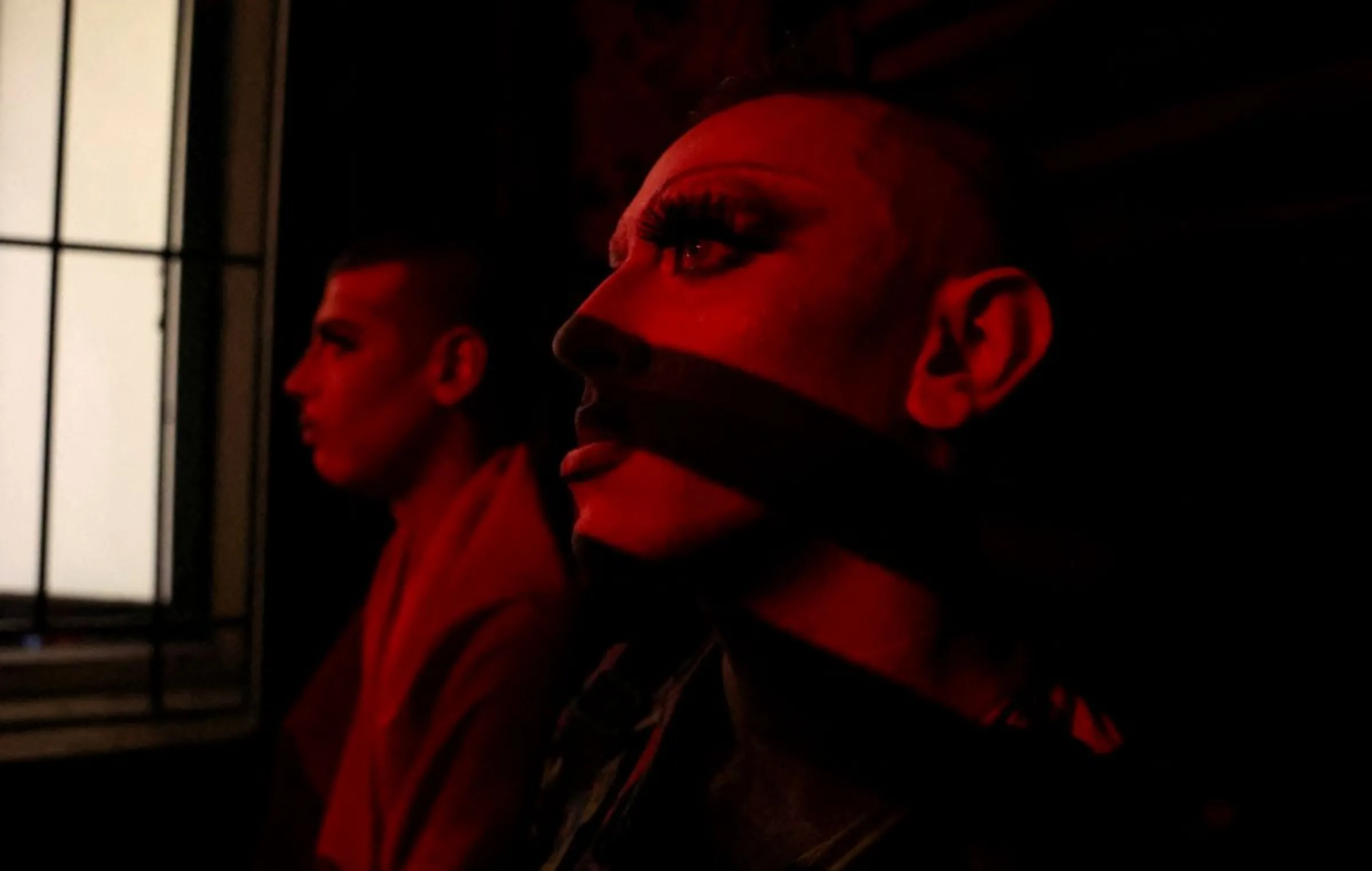 A drag artist hides  after they were attacked by a group of conservative Christians in Beirut, Lebanon August 23, 2023. REUTERS/Emilie Madi