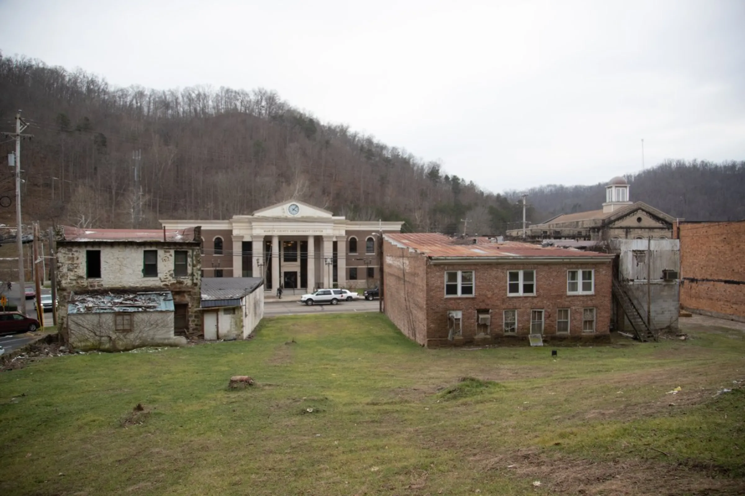 The Martin County government center stands between dilapidated buildings in downtown Inez, Kentucky, January 25, 2022. Thomson Reuters Foundation/Amira Karaoud