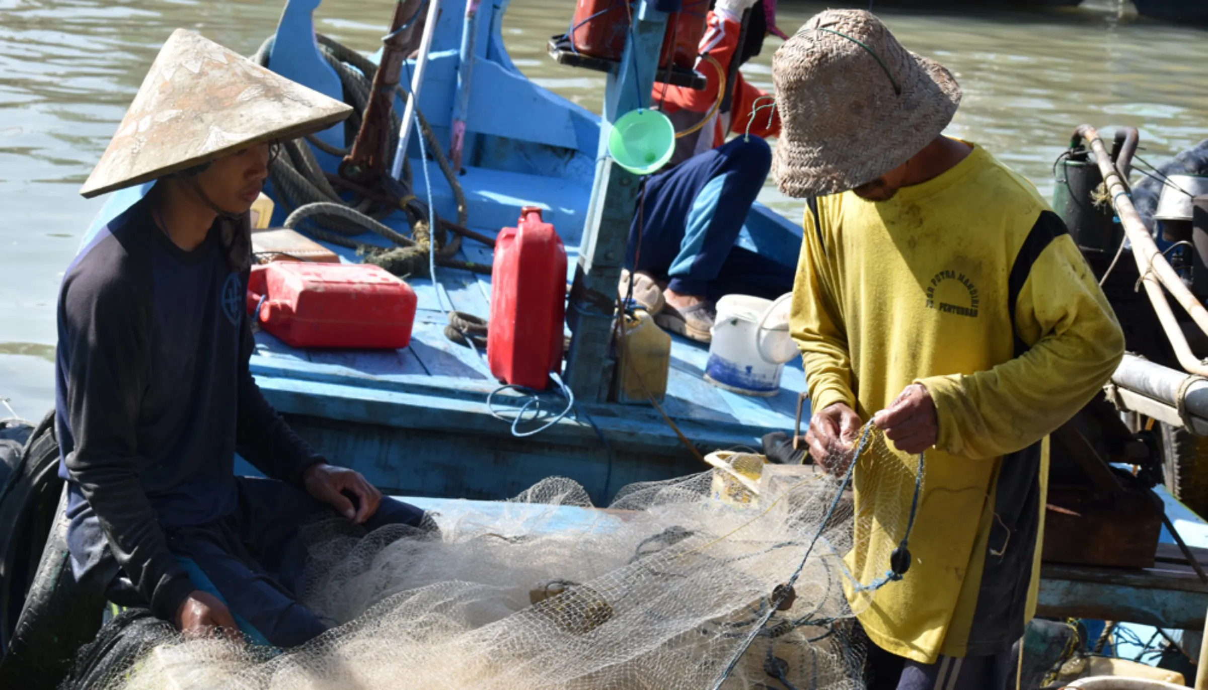 Fishers sort through their daily catches in Karanggeng village in Central Java, Indonesia, August 13, 2022