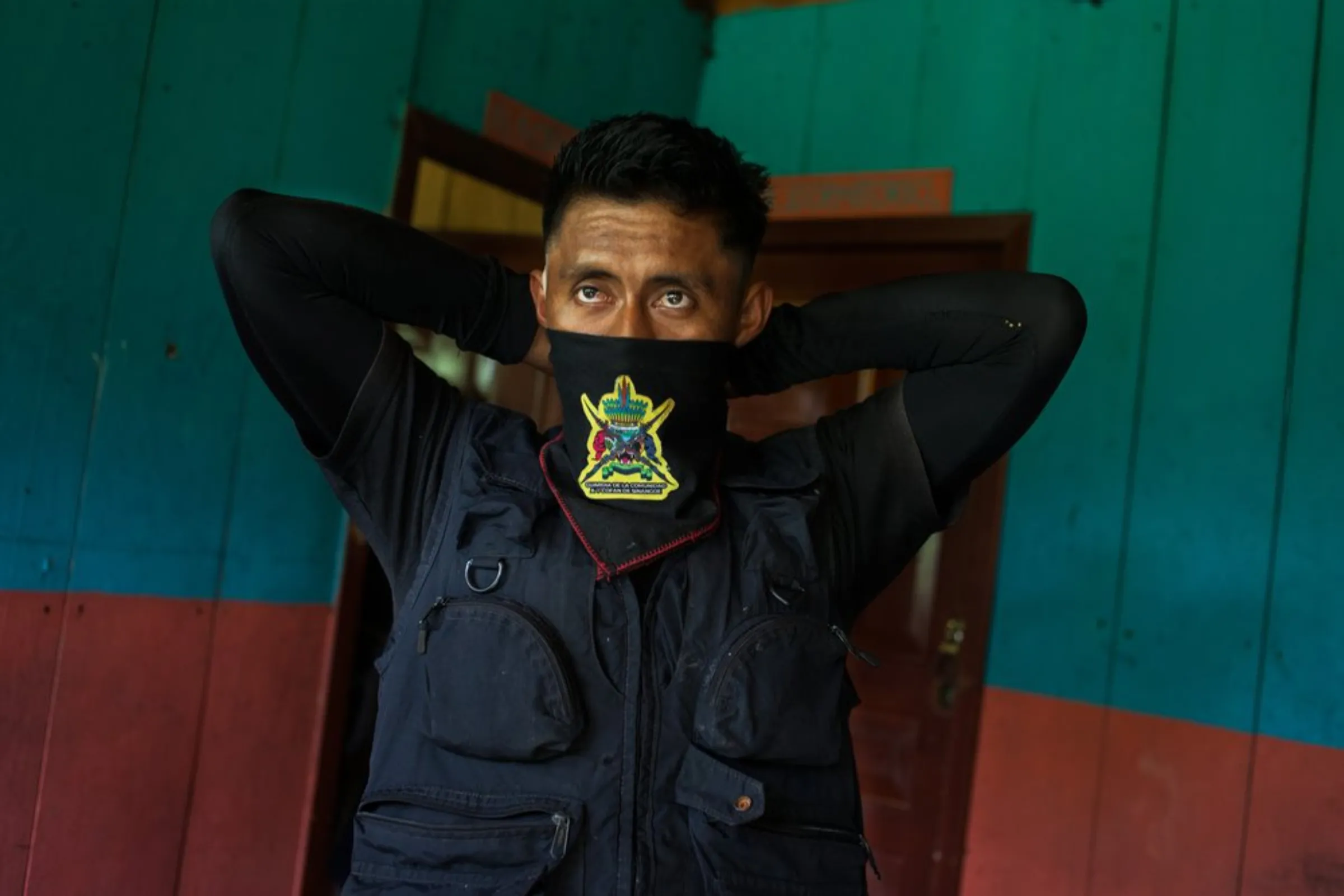 Edison Narvaez, a member of the Cofan indigenous guard, prepares to go on patrol at the village of Sinangoe, Ecuador, on April 21, 2022