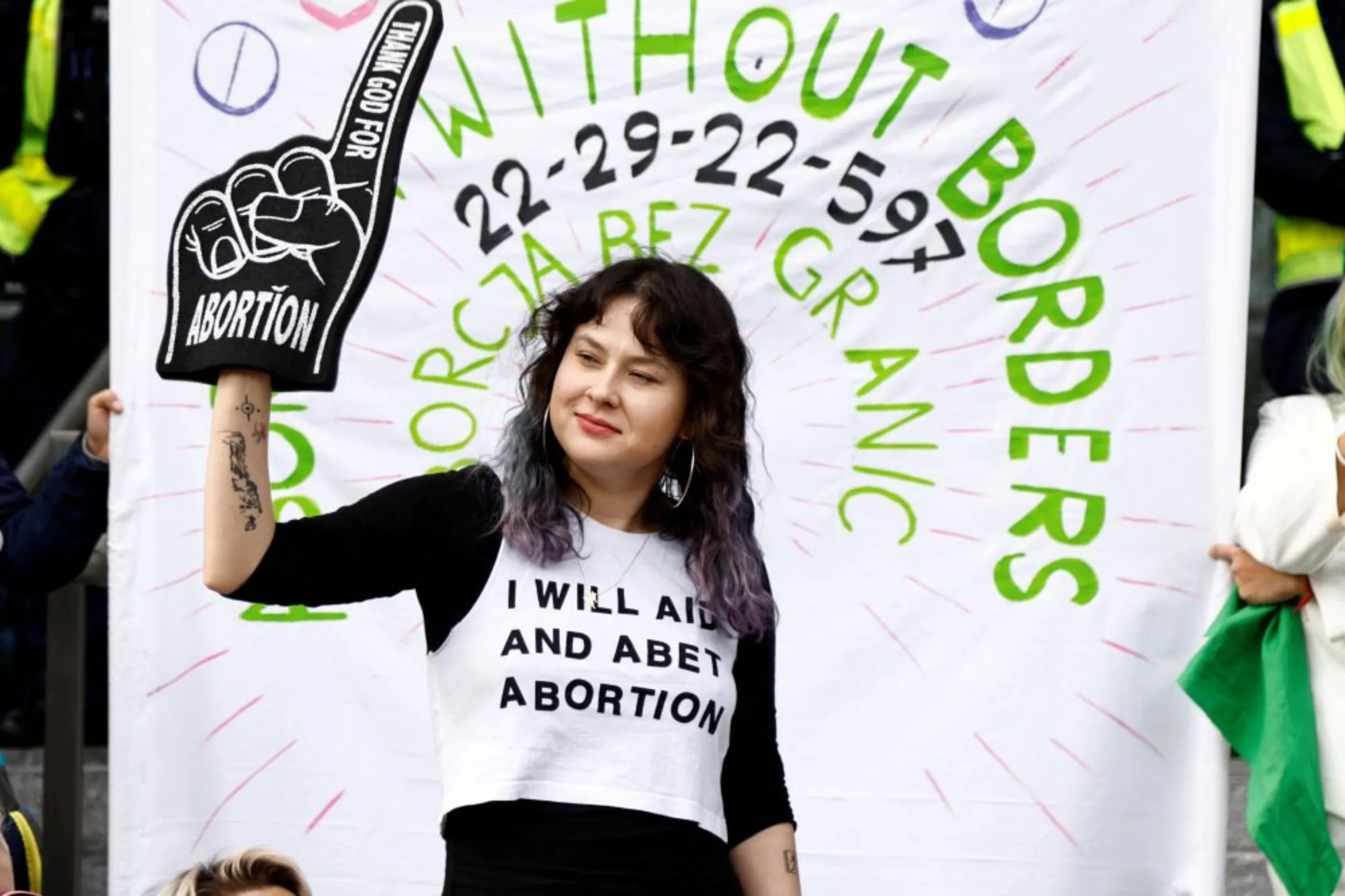 A woman holds a prop during a protest outside the court where Justyna Wydrzynska, an abortion activist, is in trial, in Warsaw, Poland, October 14, 2022