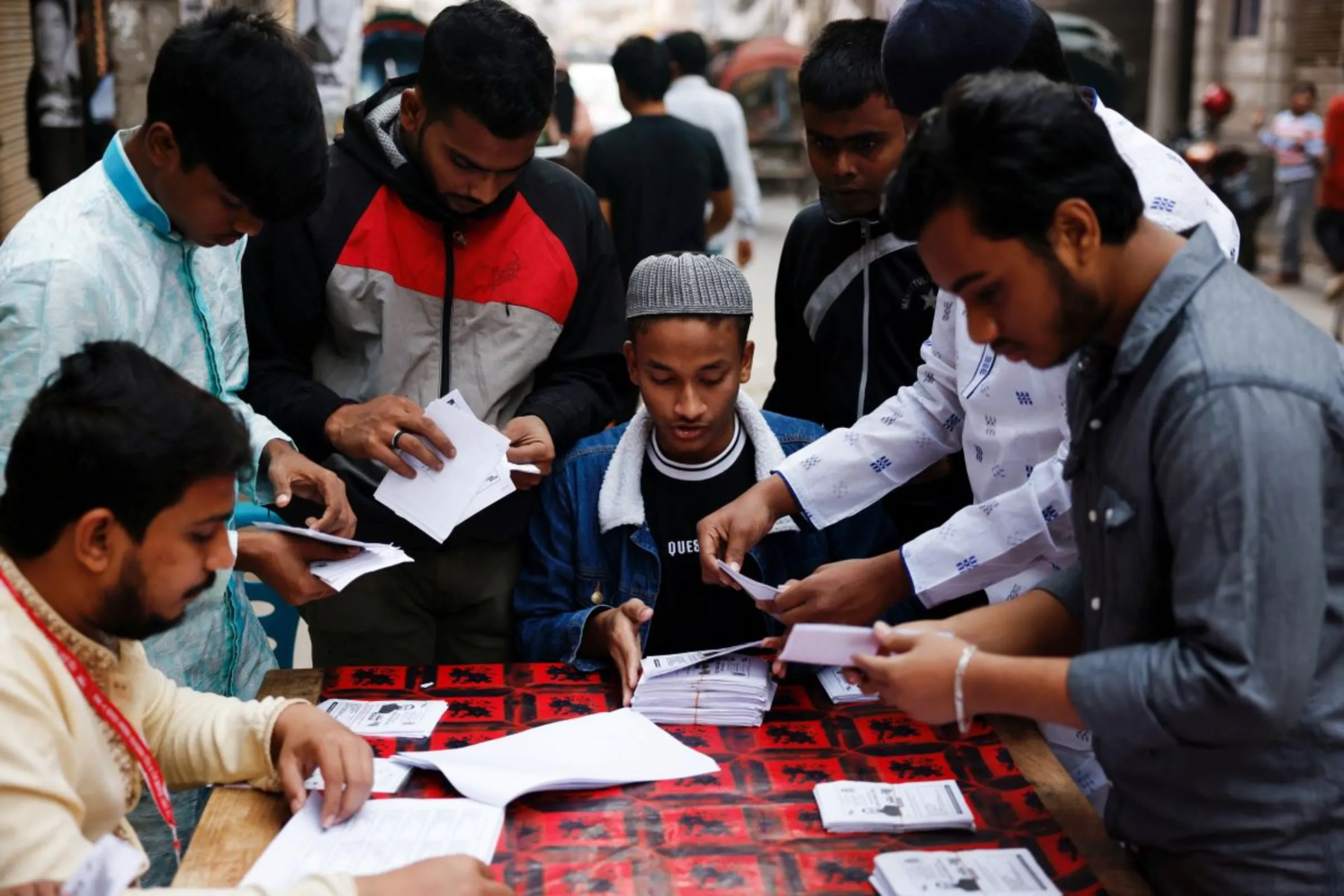 Volunteers prepare voting slips for the local voters, as part of election preparation, ahead of the general election in Dhaka, Bangladesh, January 5, 2024. REUTERS/Mohammad Ponir Hossain