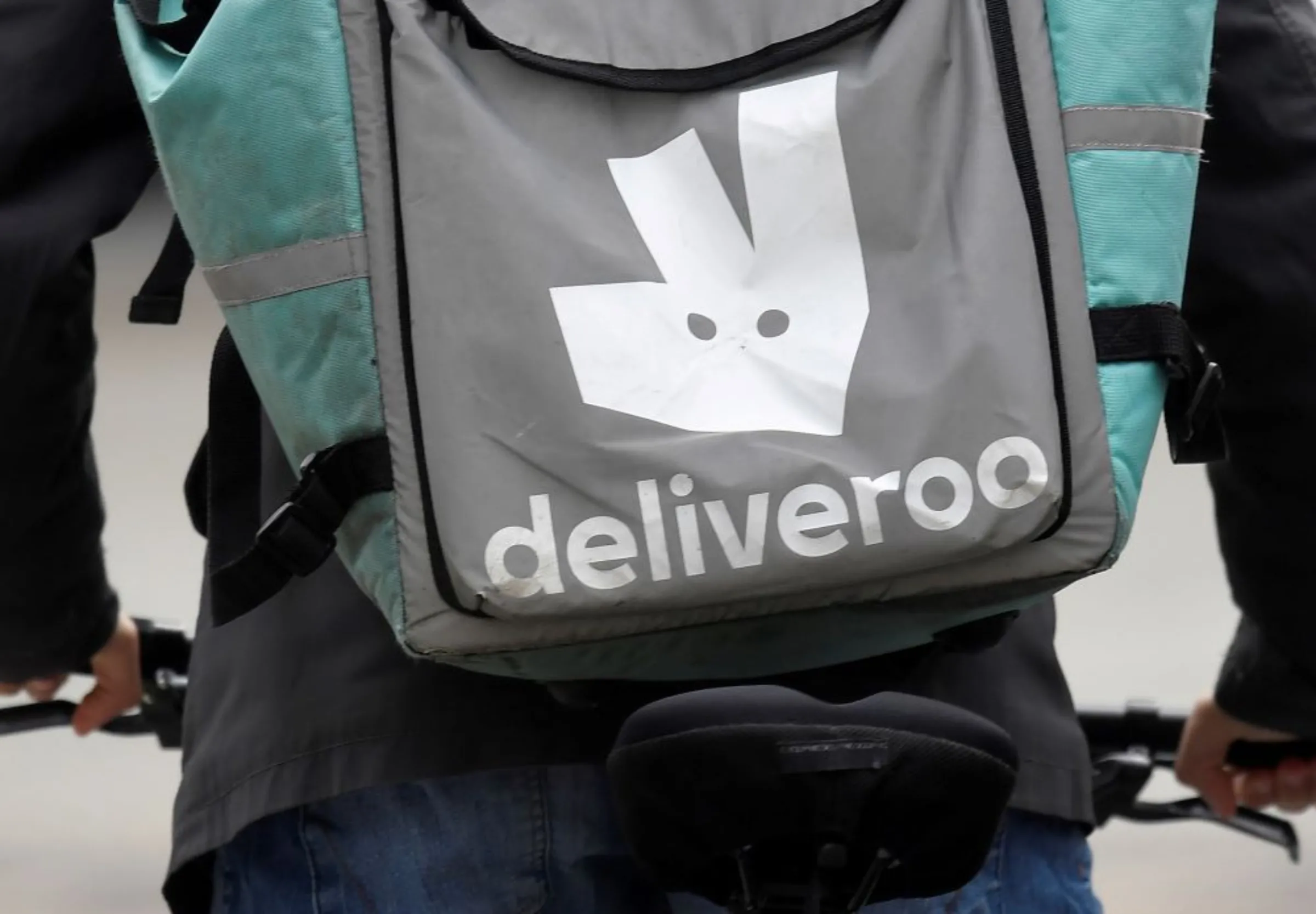 A Deliveroo delivery rider cycles in London, Britain, March 31, 2021. REUTERS/Toby Melville