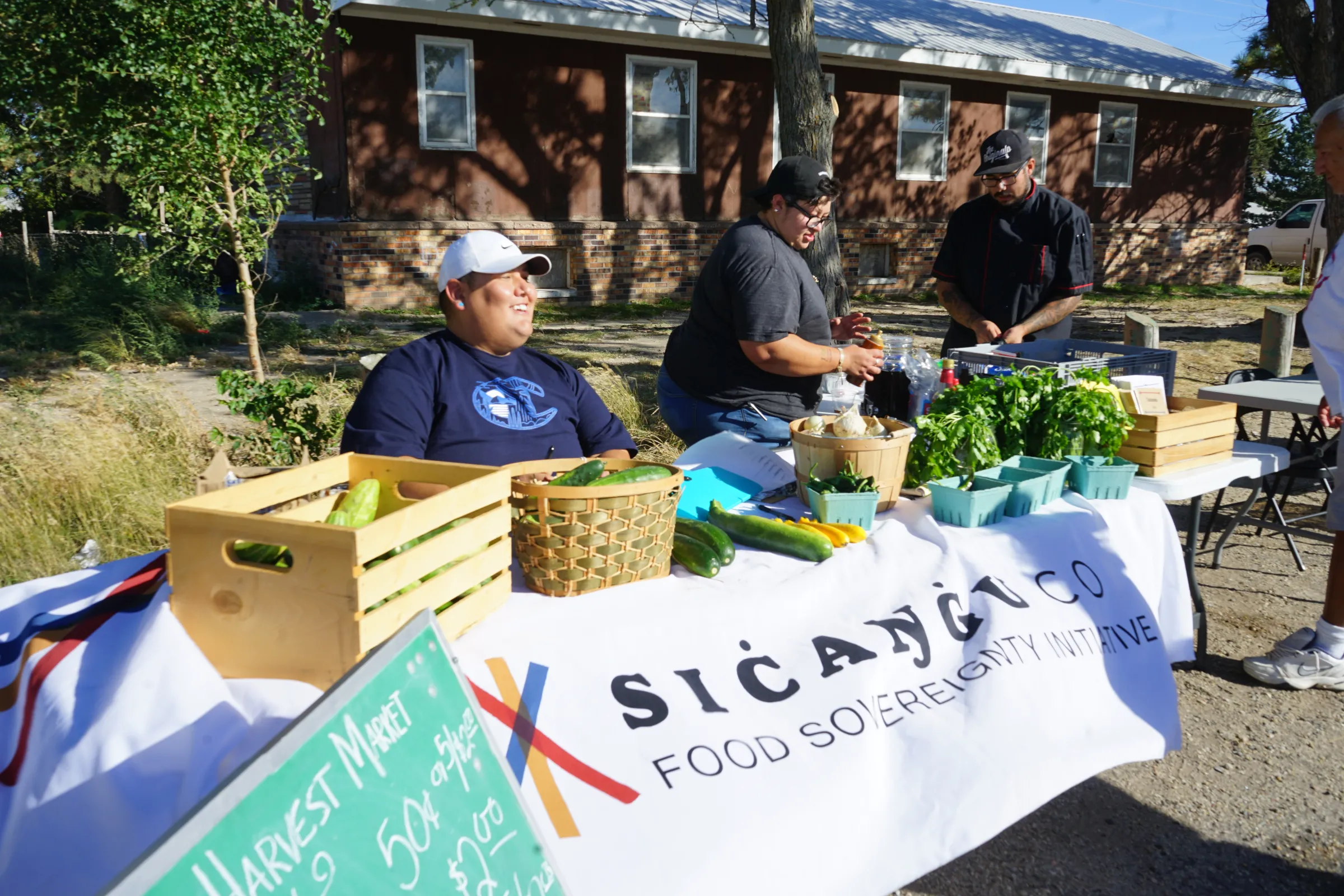 Matte Wilson shares space at the Food Sovereignty Initiative booth at the Sicangu Harvest Market.