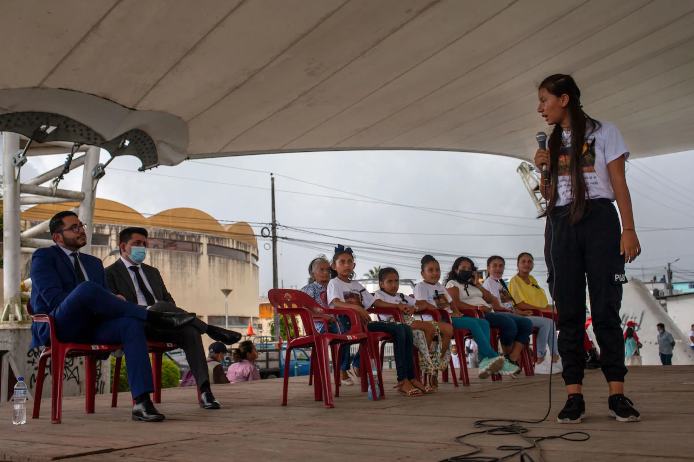 11-year-old Ecuadorean Leonela Moncayo addresses government officials during an event in when they gave a public apology to Moncayo and other 8 plaintiffs demanding gas flares be removed. Lago Agrio, Ecuador. April 20, 2022. Thomson Reuters Foundation/Fabio Cuttica