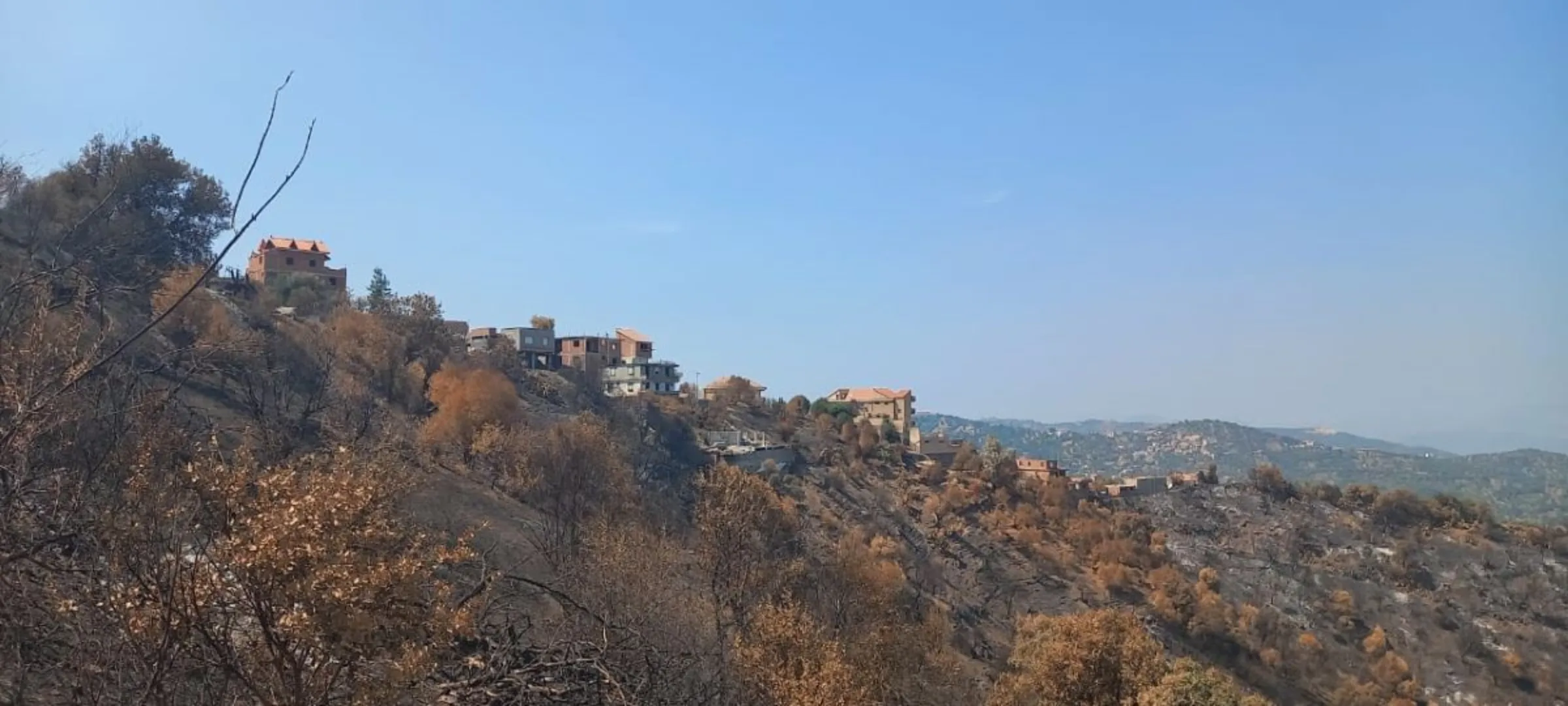 Families living in villages affected by the wildfires this year were evacuated, saving lives, Tizi Ouzou. Algeria, 21 August, 2024, Madjid Serrah/Thomson Reuters Foundation