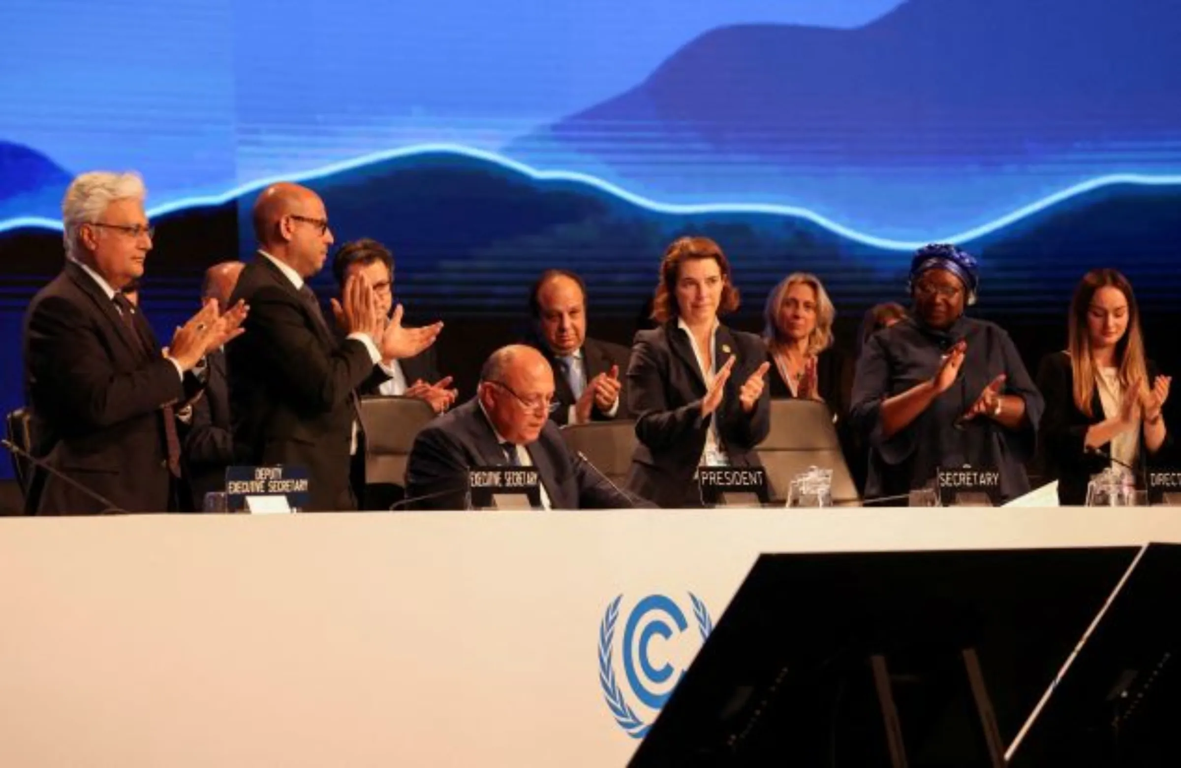 Delegates applaud as COP27 President Sameh Shoukry delivers a statement during the closing plenary at the COP27 climate summit in Red Sea resort of Sharm el-Sheikh, Egypt, November 20, 2022. REUTERS/Mohamed Abd El Ghany