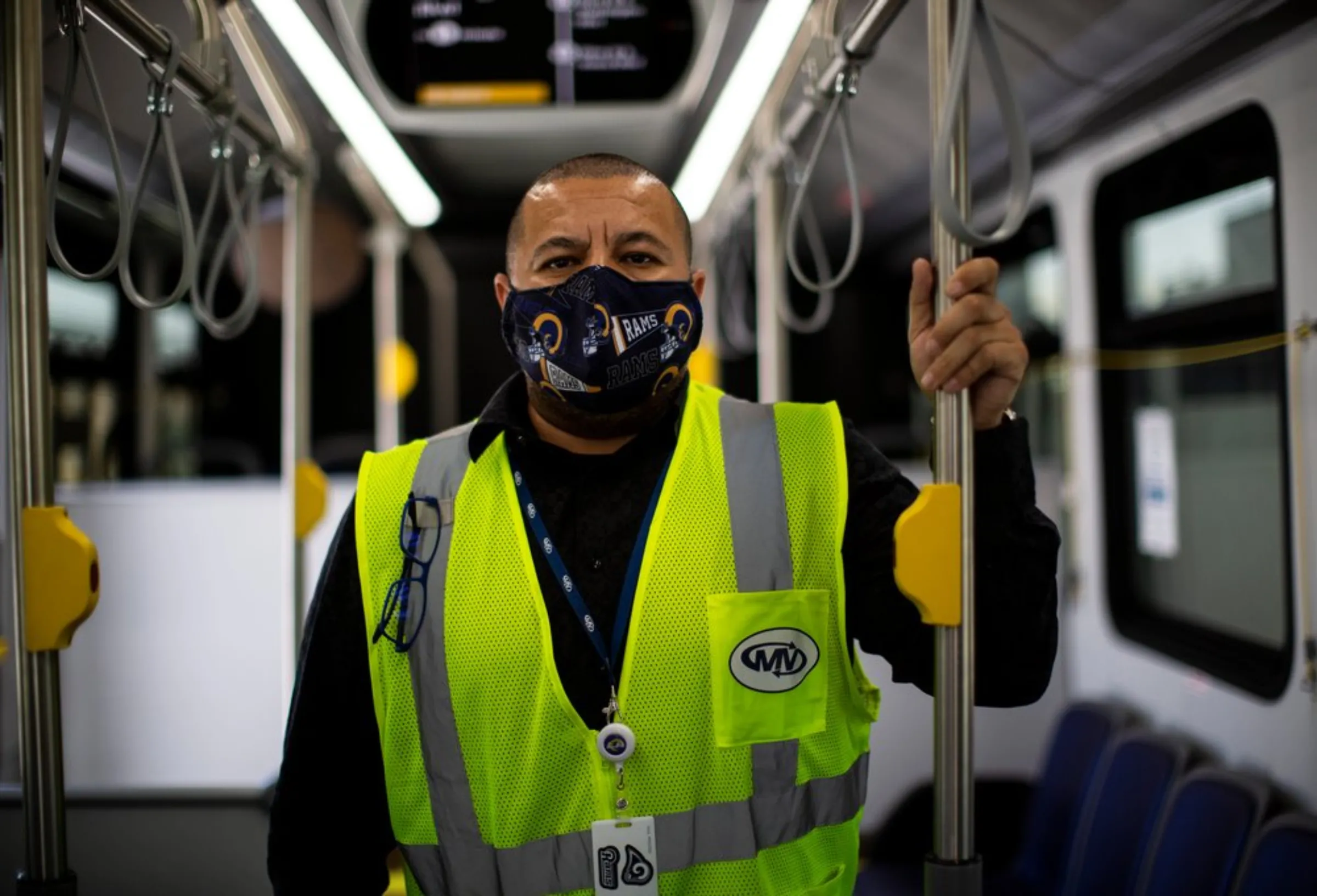 Albert Flores, a supervisor in charge of training new bus drivers, stands inside an electric bus – part of an expanding city fleet - at a depot in downtown Los Angeles, May 18, 2021