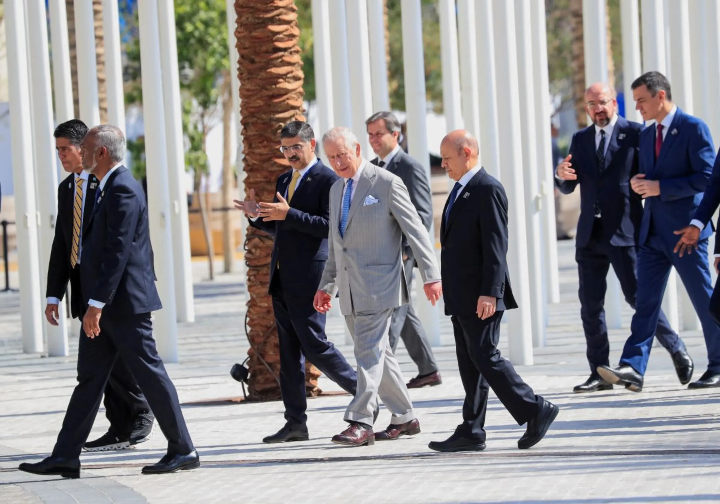 Britain's King Charles walks along with other world leaders and delegates at Dubai's Expo City ahead of the World Climate Action Summit during the United Nations Climate Change Conference (COP28) in Dubai, United Arab Emirates, December 1, 2023