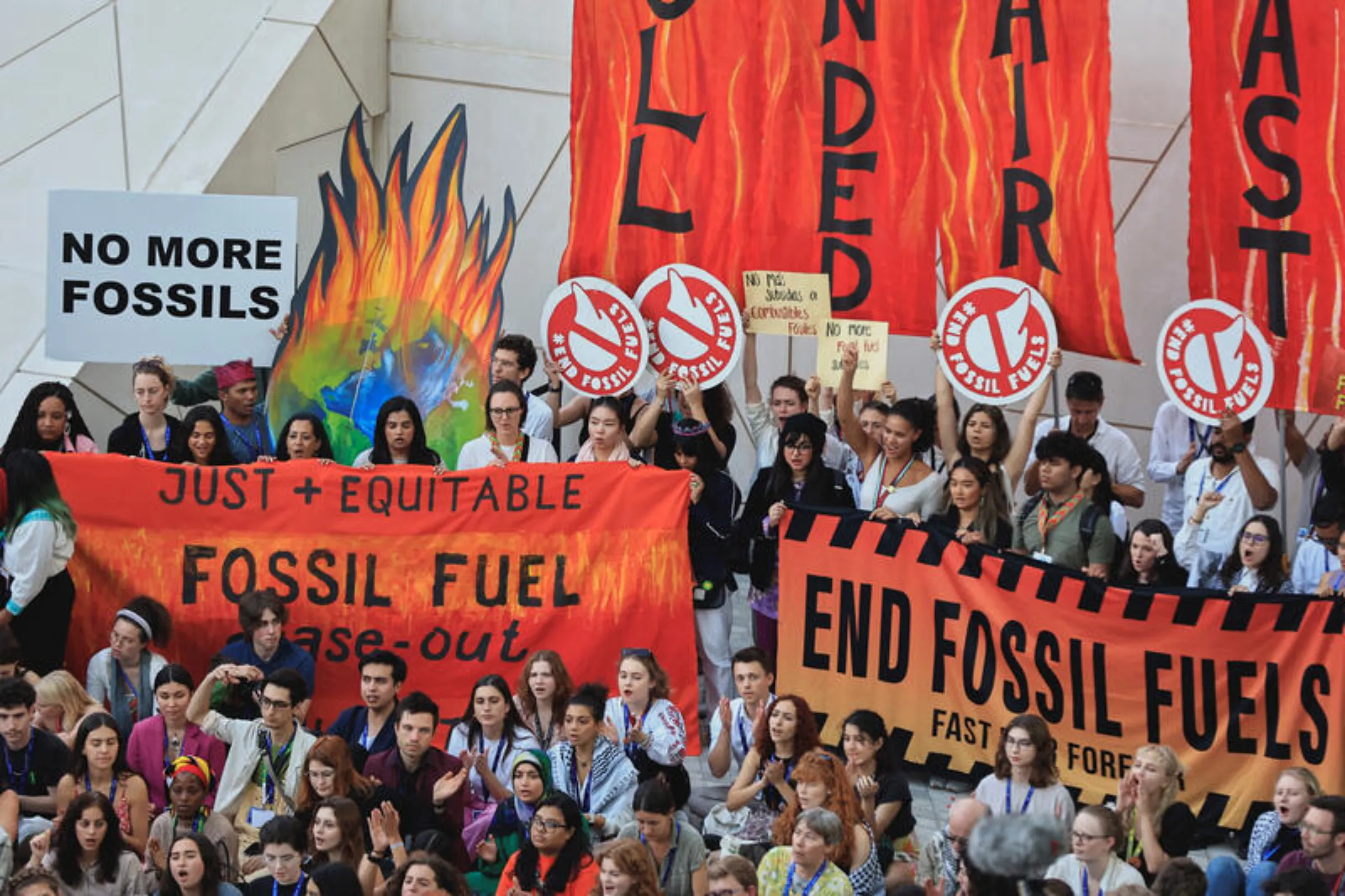 Climate activists protest against fossil fuels during the final stages of the United Nations Climate Change Conference (COP28), in Dubai, United Arab Emirates, December 12, 2023. REUTERS/Thaier Al-Sudani