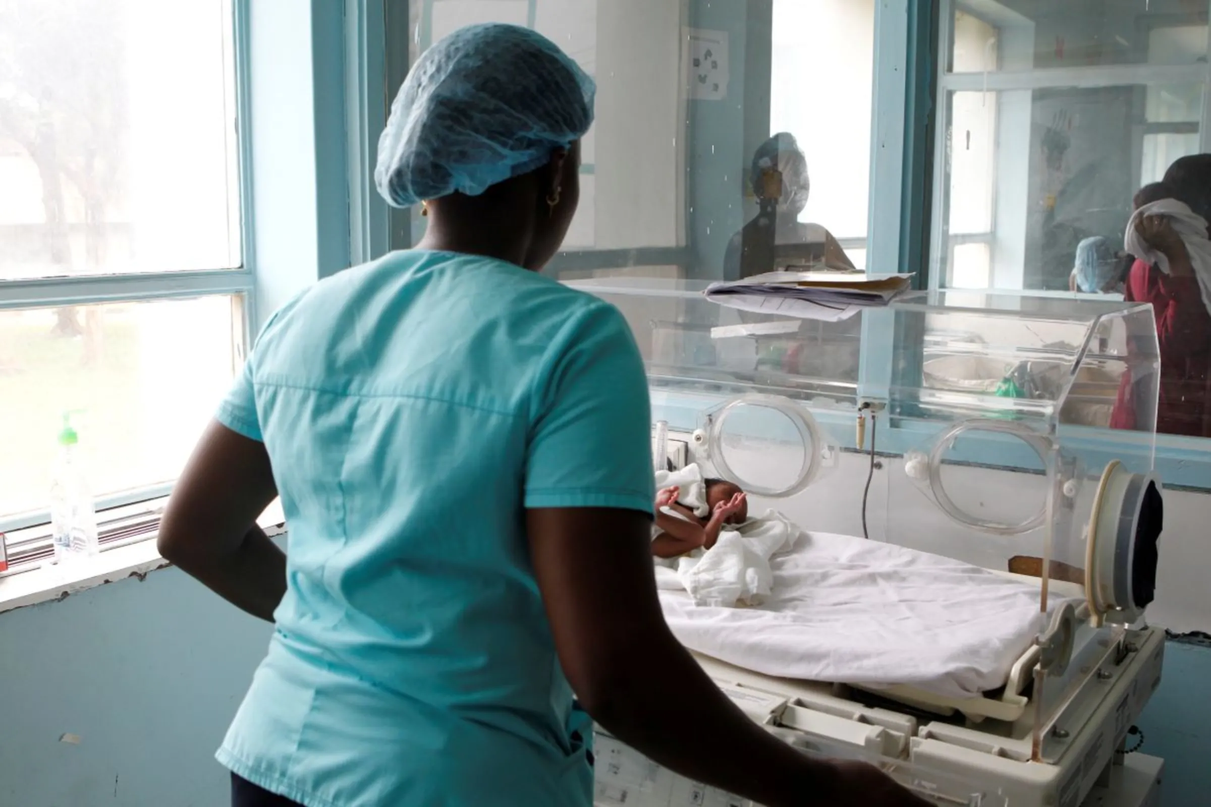 A nurse places a newborn baby in an incubator at the Pumwani Maternity Hospital in Nairobi, Kenya October 17, 2019. Picture taken October 17, 2019. REUTERS/Njeri Mwangi