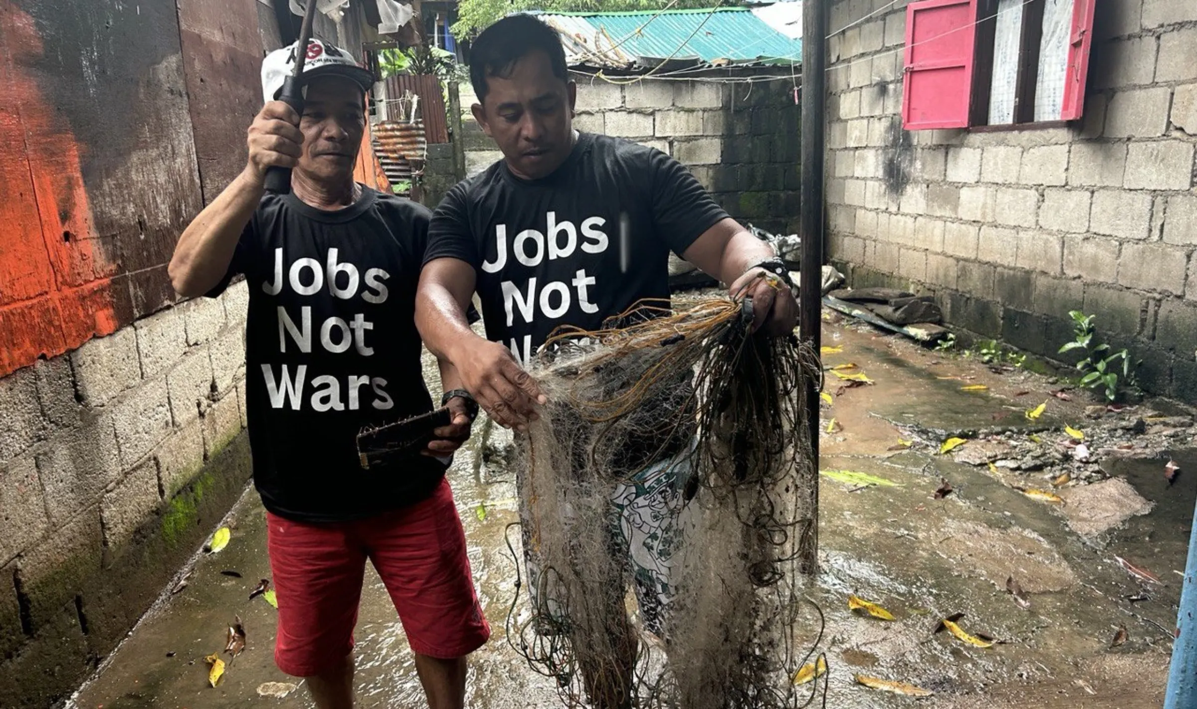 Small-scale fishermen are forced to stay indoors after an oil spill and a series of storms affected their village. Bataan, Philippines. Mariejo Ramos/Thomson Reuters Foundation