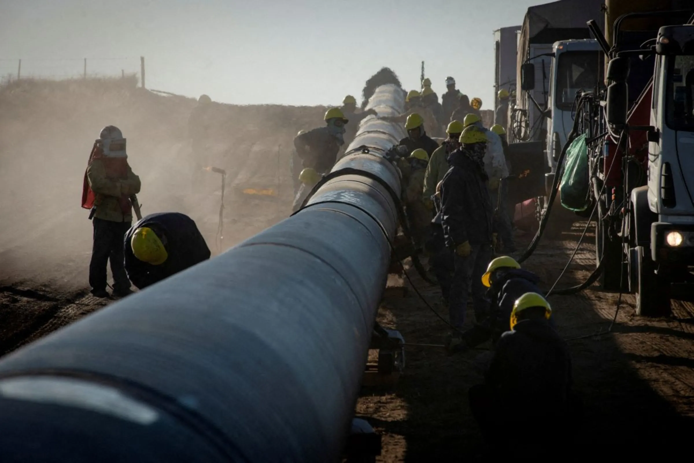 Workers are pictured during the construction of the Nestor Kirchner gas pipeline, in Macachin, La Pampa, Argentina April 26, 2023