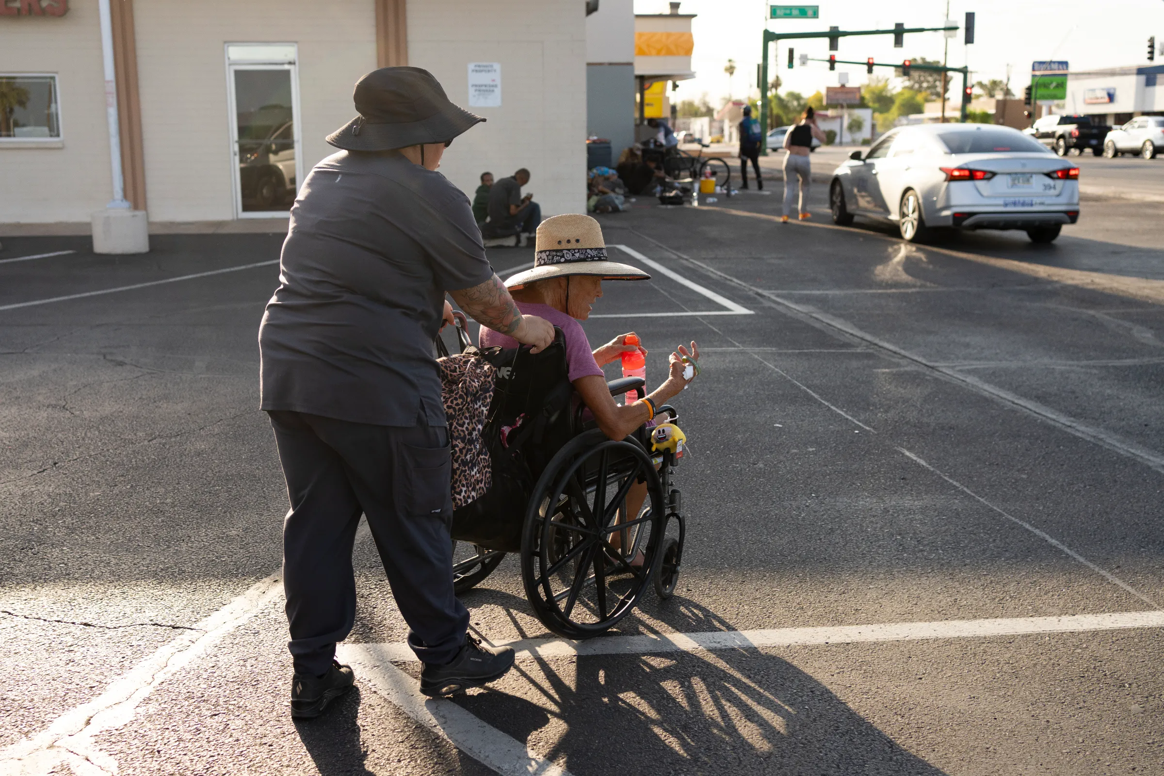 Maritza Arias of Circle the City takes unhoused street resident Maurajean Bunn to inquire about a shelter space for her. July 15, 2024. Thomson Reuters Foundation/Rebecca Noble